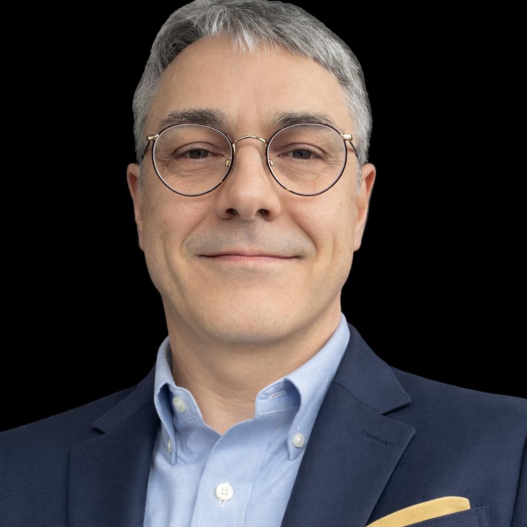 Portrait of a person in a pink sweater against a light background