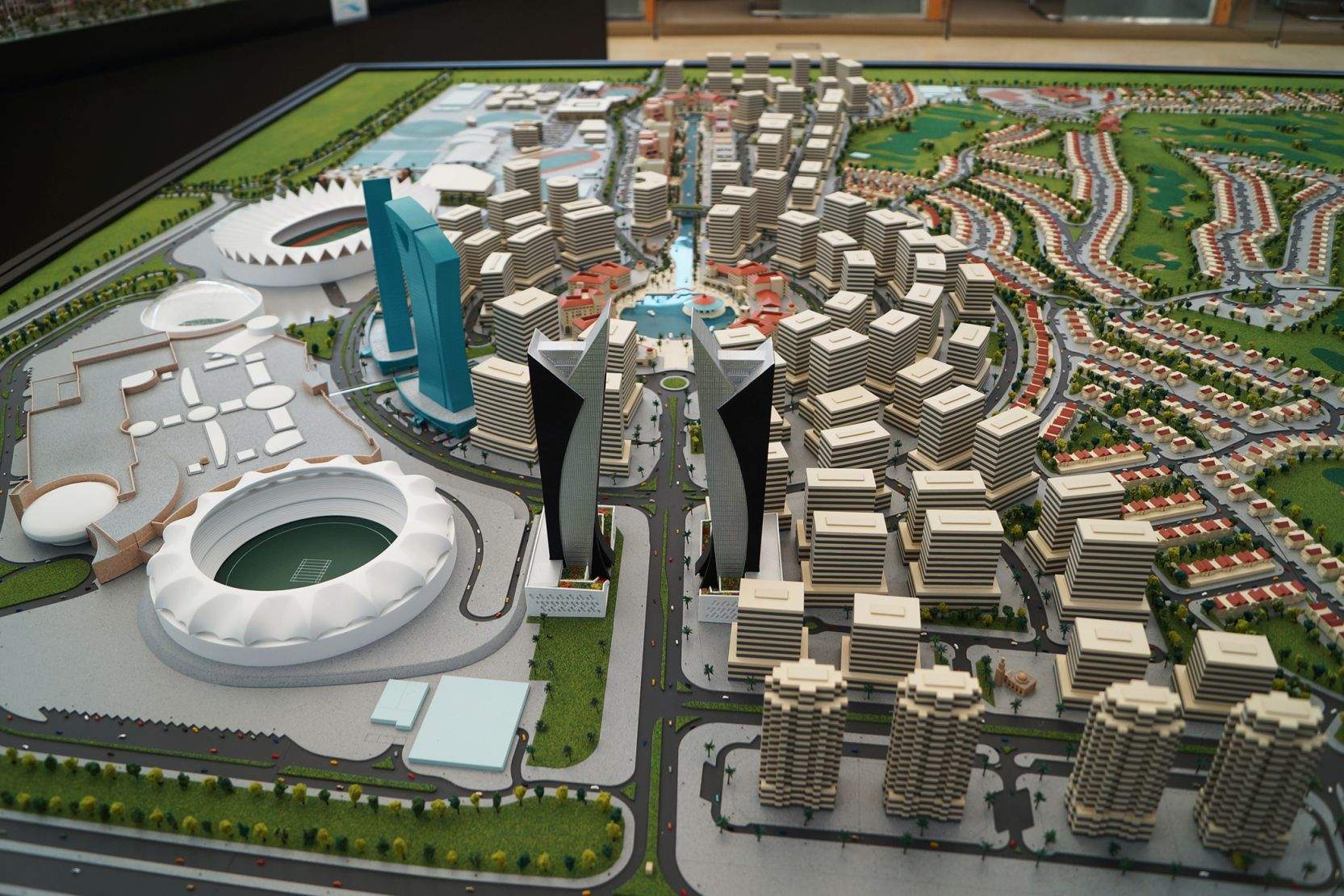 A miniature model of the Dubai Sports City community, featuring model skyscrapes, housing, buildings, and other areas.