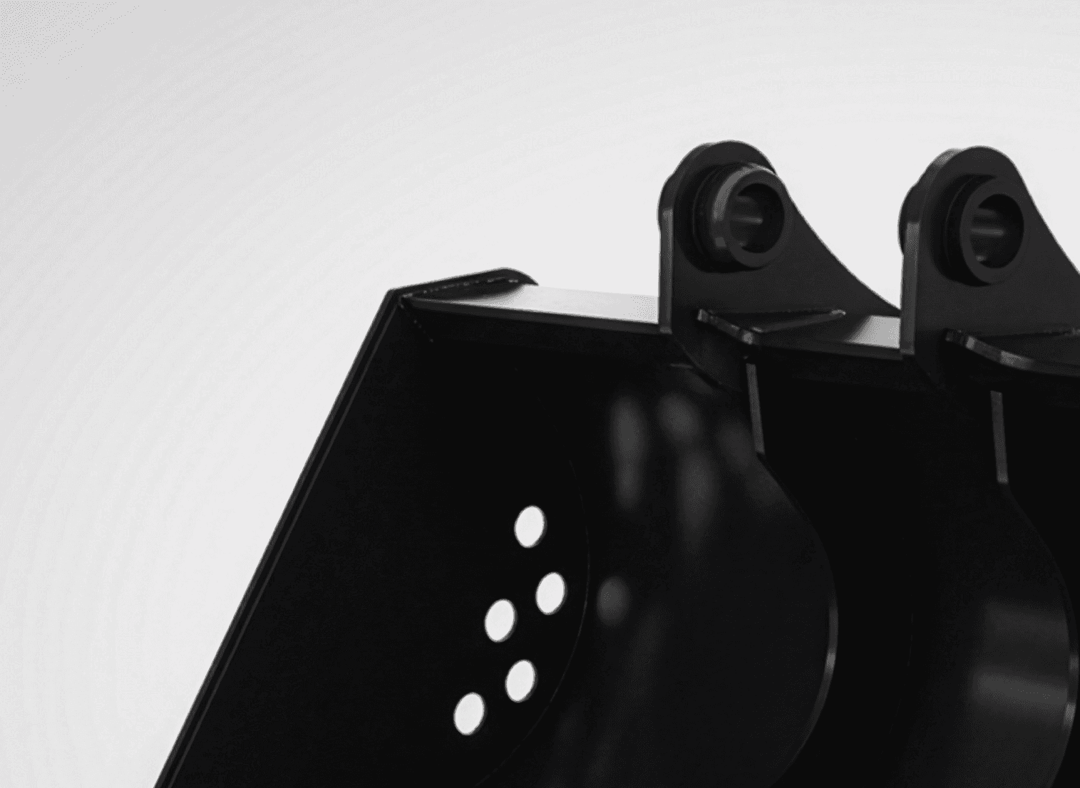 Expansive solar panel array under clear blue sky with distant hills in the background.