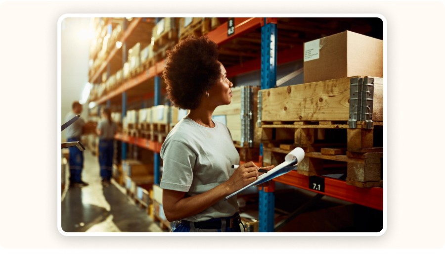 Warehouse worker inspecting pallets