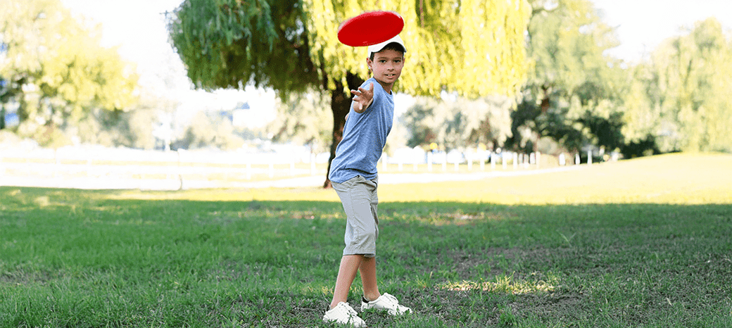 Elementary students participating in an ultimate frisbee activity during a HOKALI after-school sports program