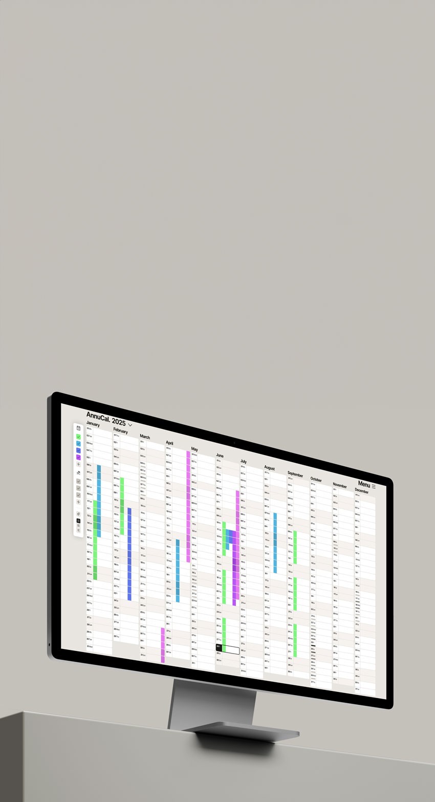 A large screen monitor shows Annucal Yearly Calendar View