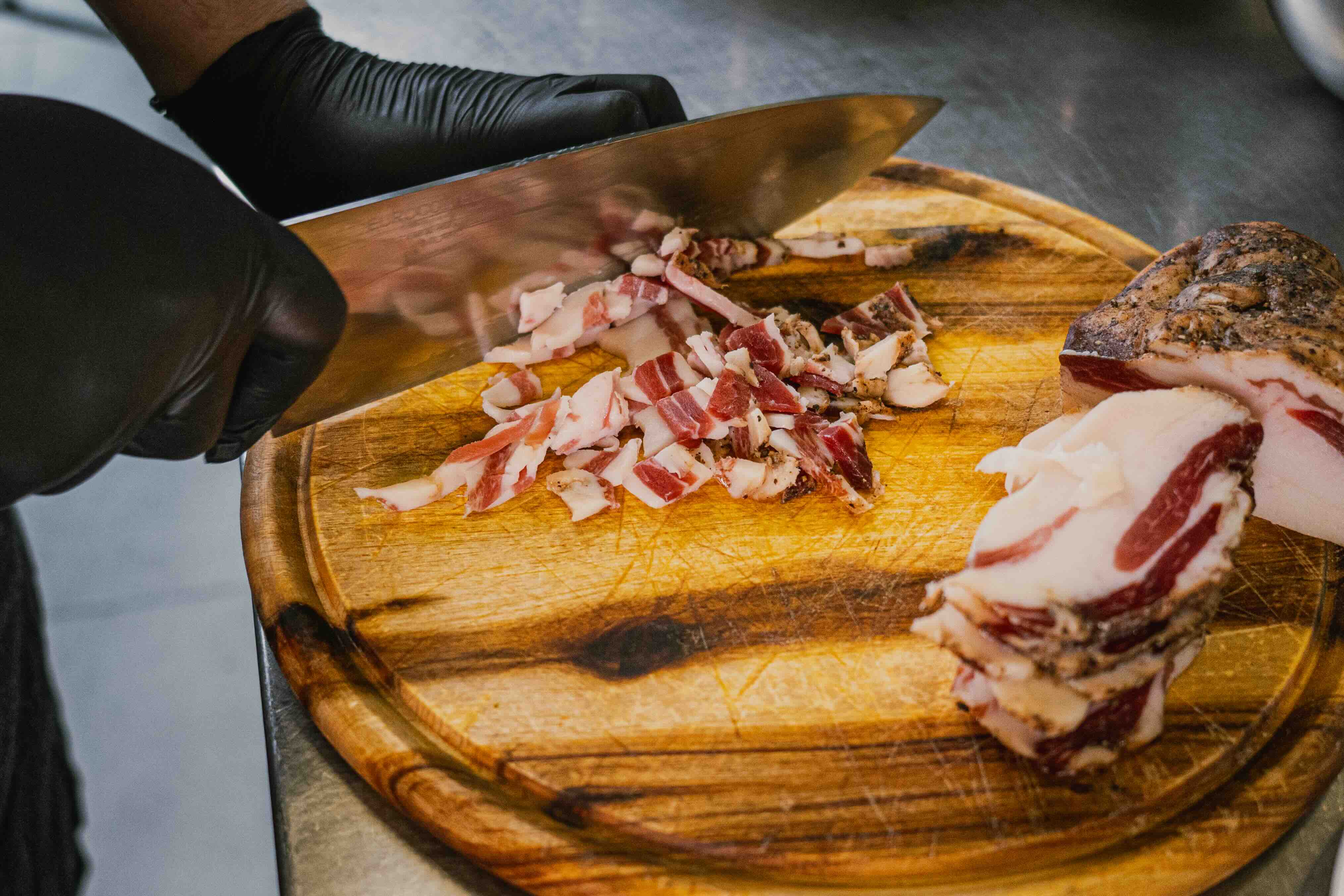 Two people talking at table in plant-filled café