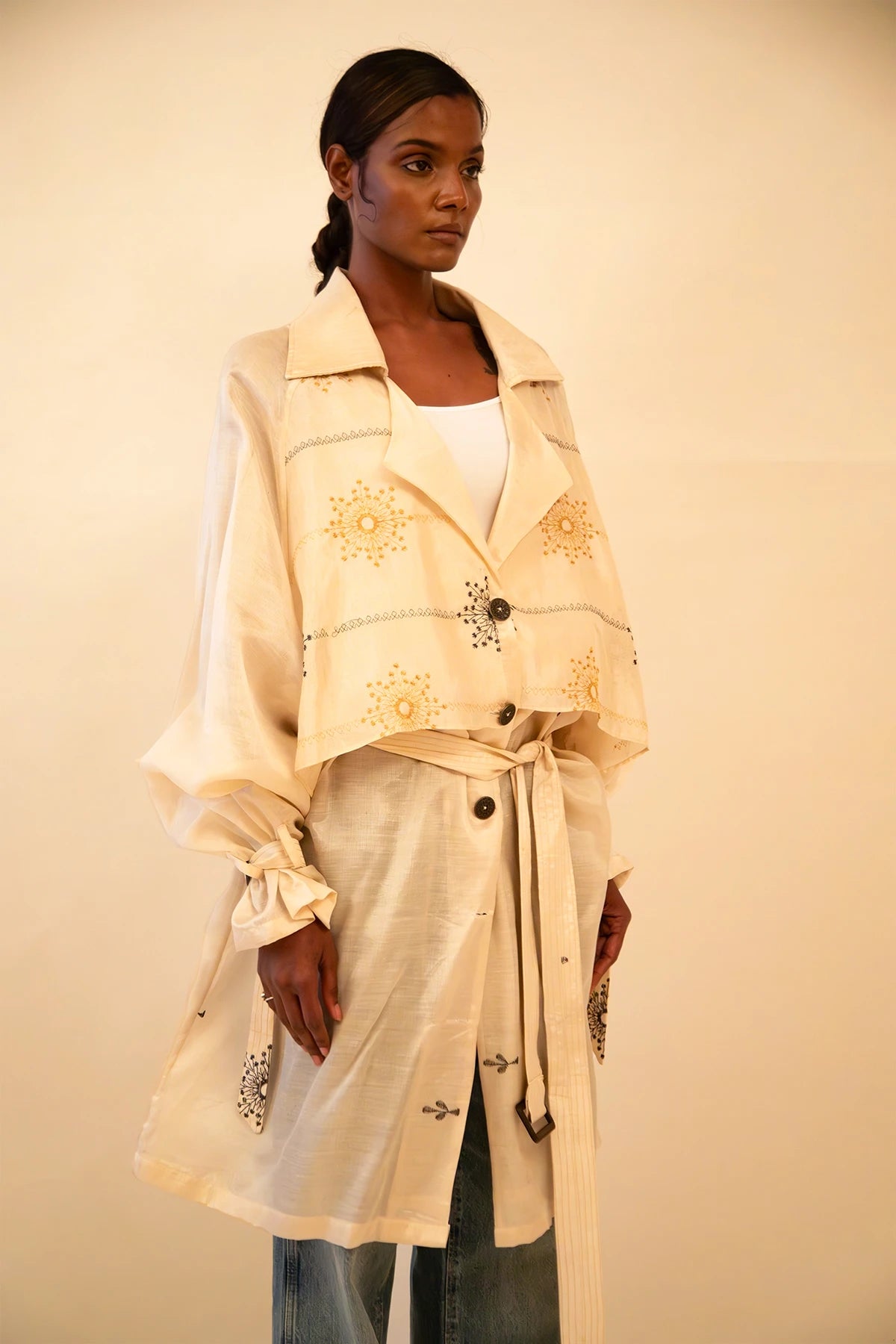 Off-white vintage trench coat without lining, featuring a relaxed fit and lightweight drape, ideal for layering and conscious styling.