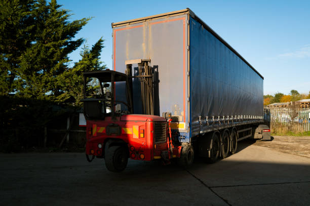 image of the back of a triler with a moffett attached to it 