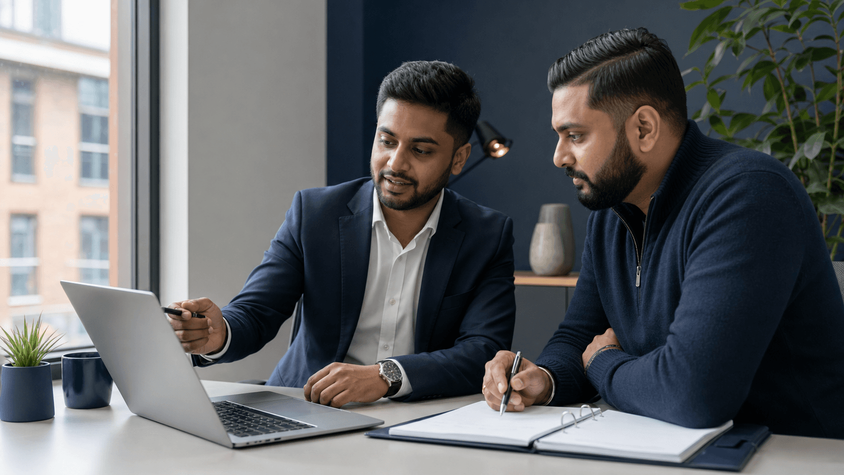 Man and woman browsing laptop