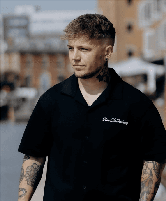 A curved facade covered in white latticework