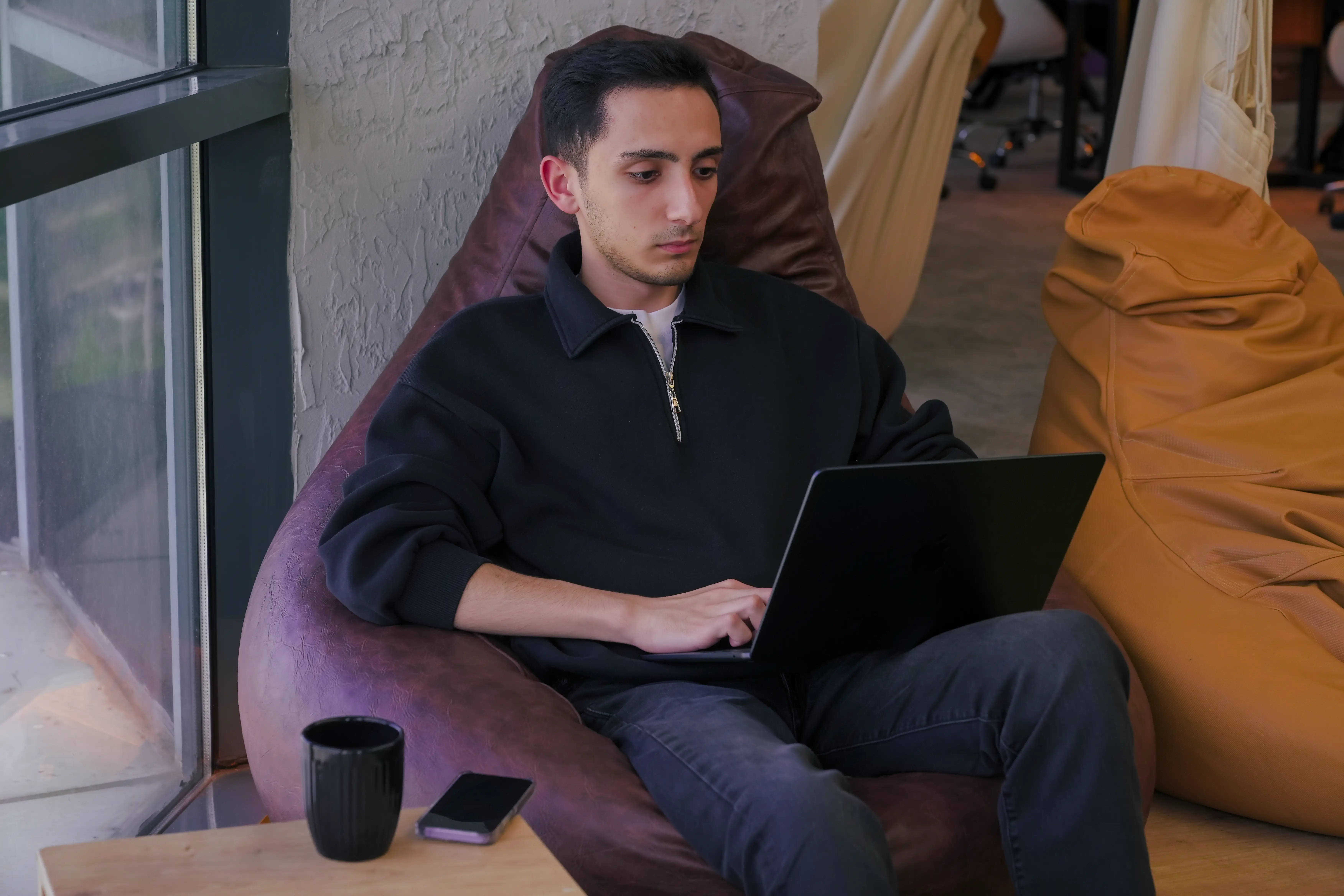 Cloud engineer configuring AWS infrastructure at the Neon Apps office