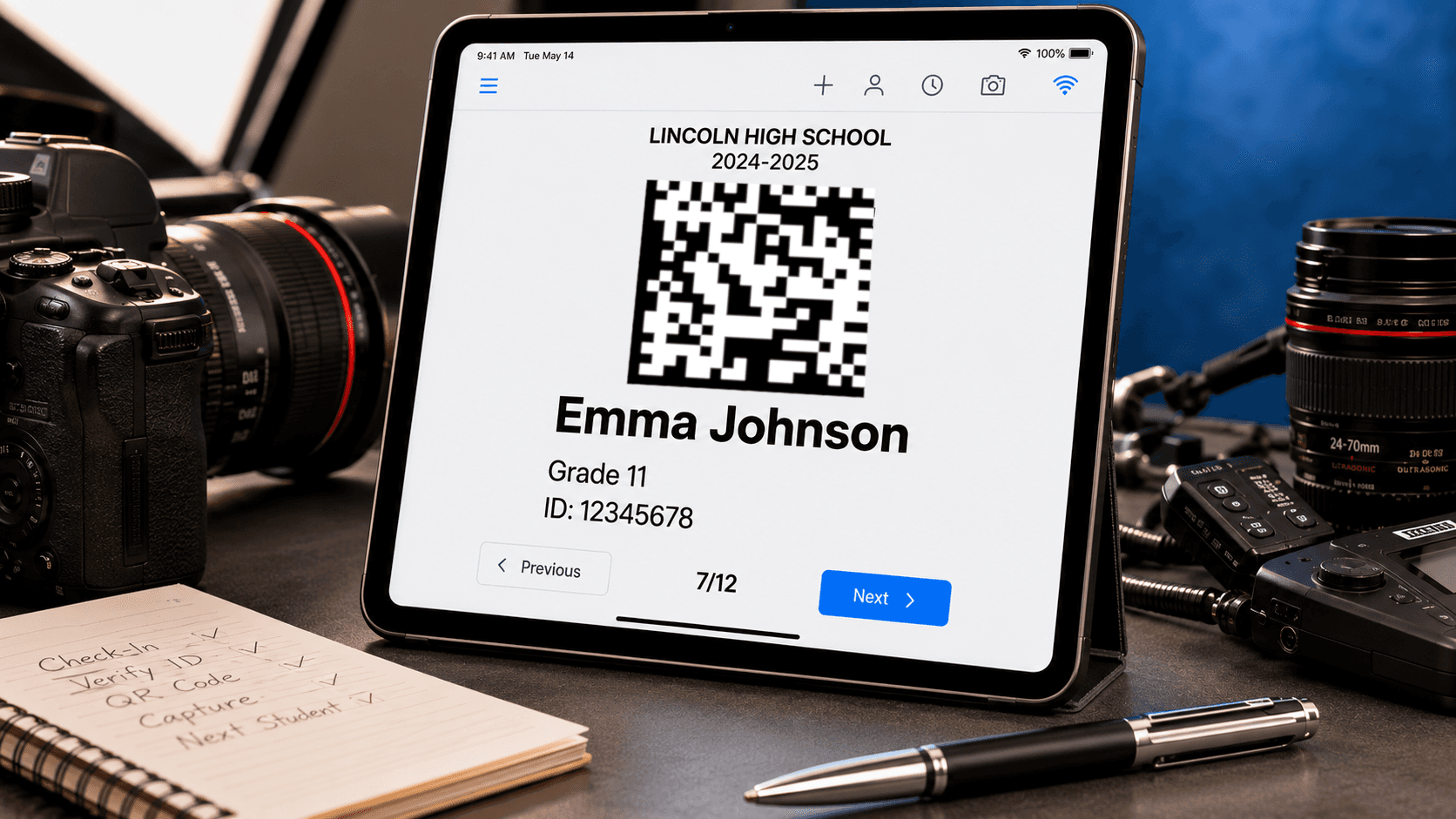 iPad displaying a digital QR code camera card with student information beside professional photography equipment, illustrating a paperless school photography workflow.