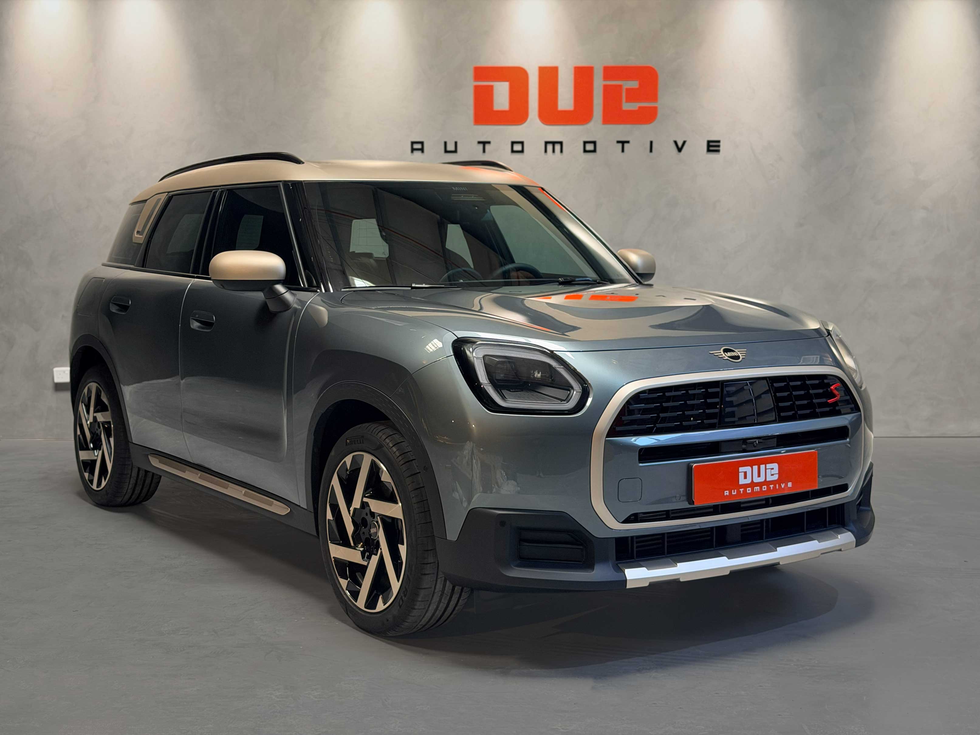Mini Countryman S featuring a custom-painted beige roof and full-body Paint Protection Film (PPF) at the workshop.