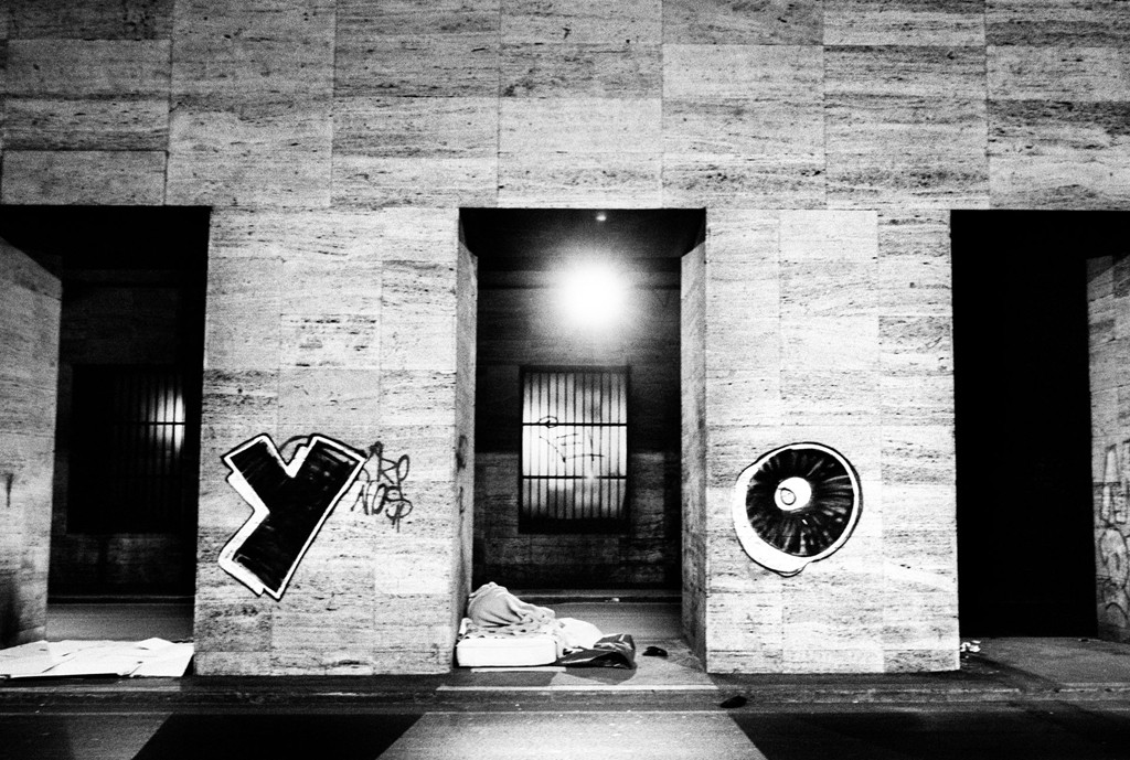 Palina – Soft Laziness – standing on a chair beneath hanging backdrops, looking away in delicate lingerie