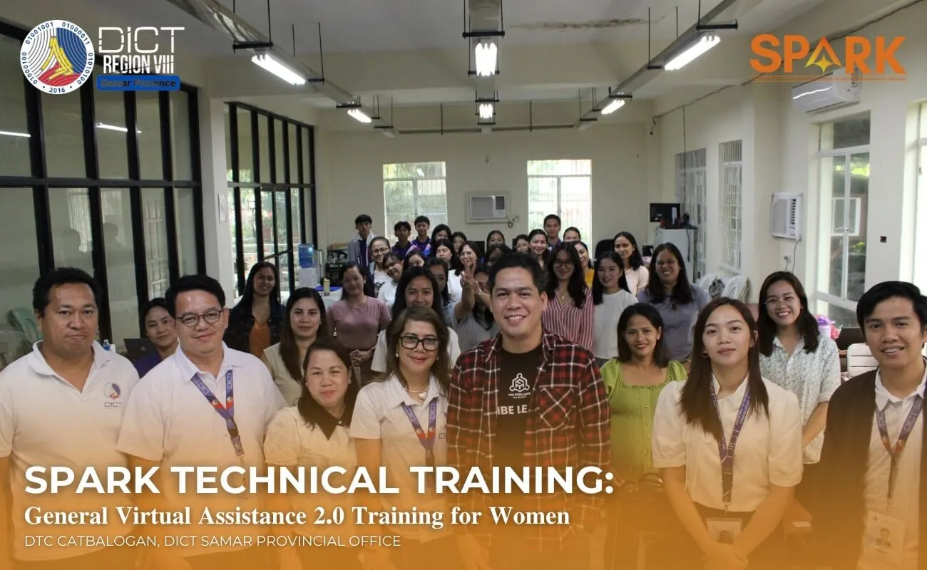 a person sitting at a desk with a laptop and a cell phone