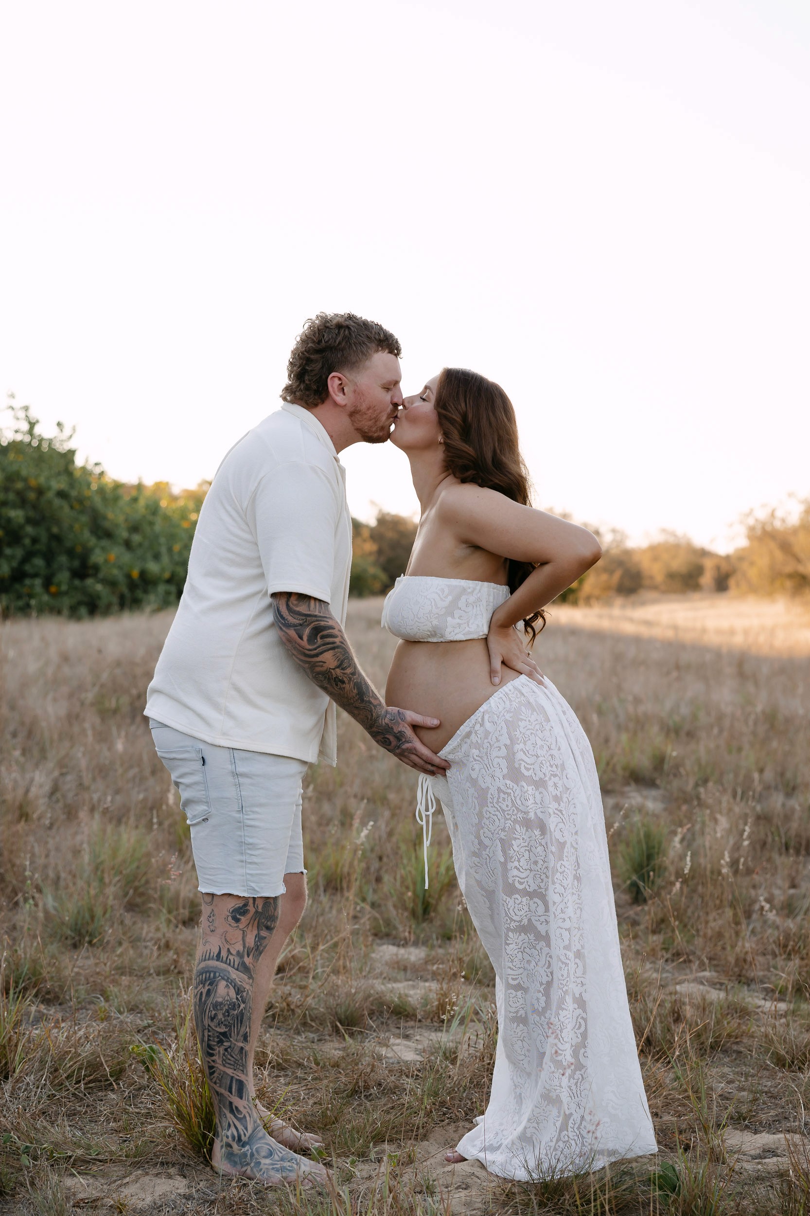 Mackay maternity photography in grassy landscape setting