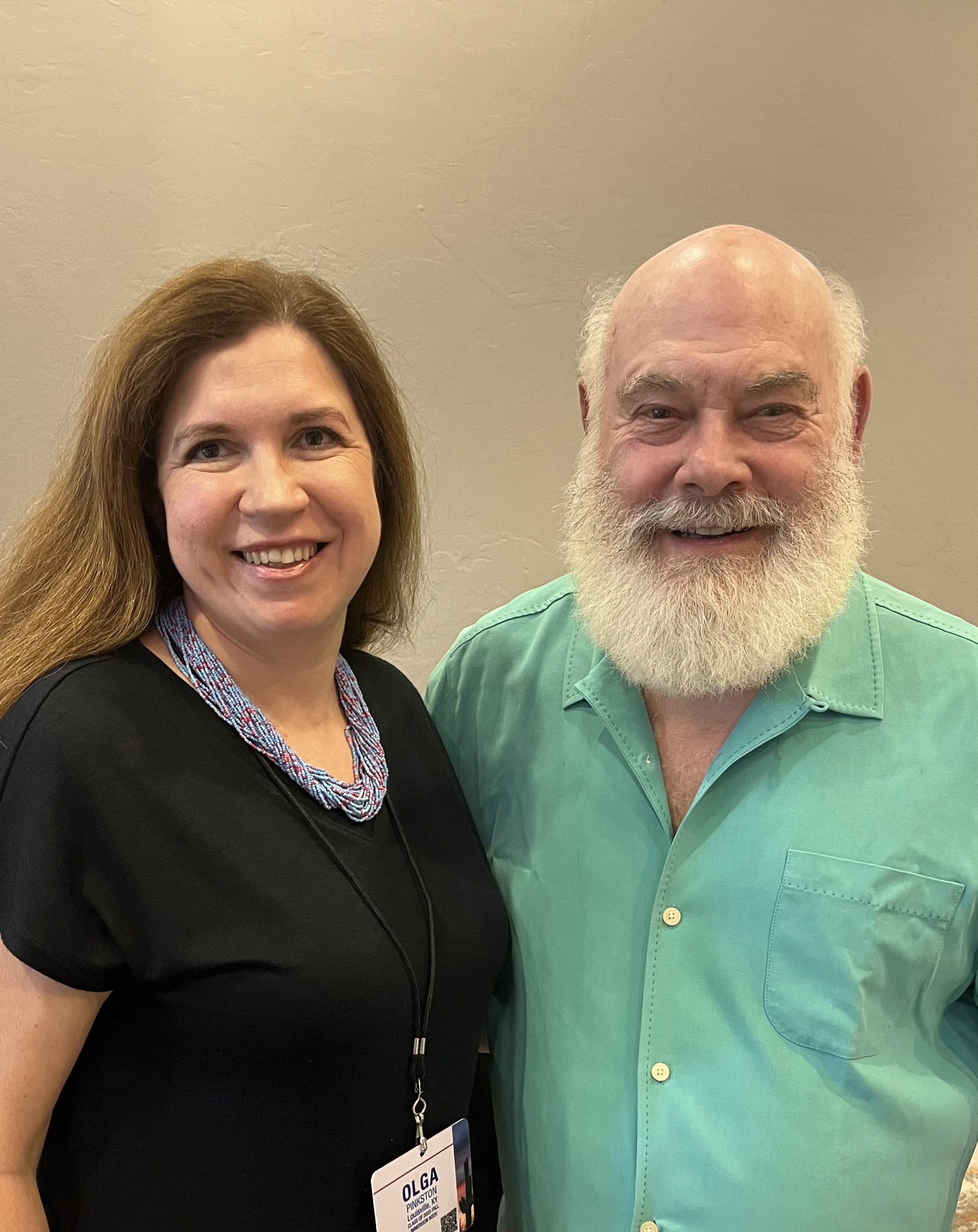 A rheumatologist smiling people stand together.