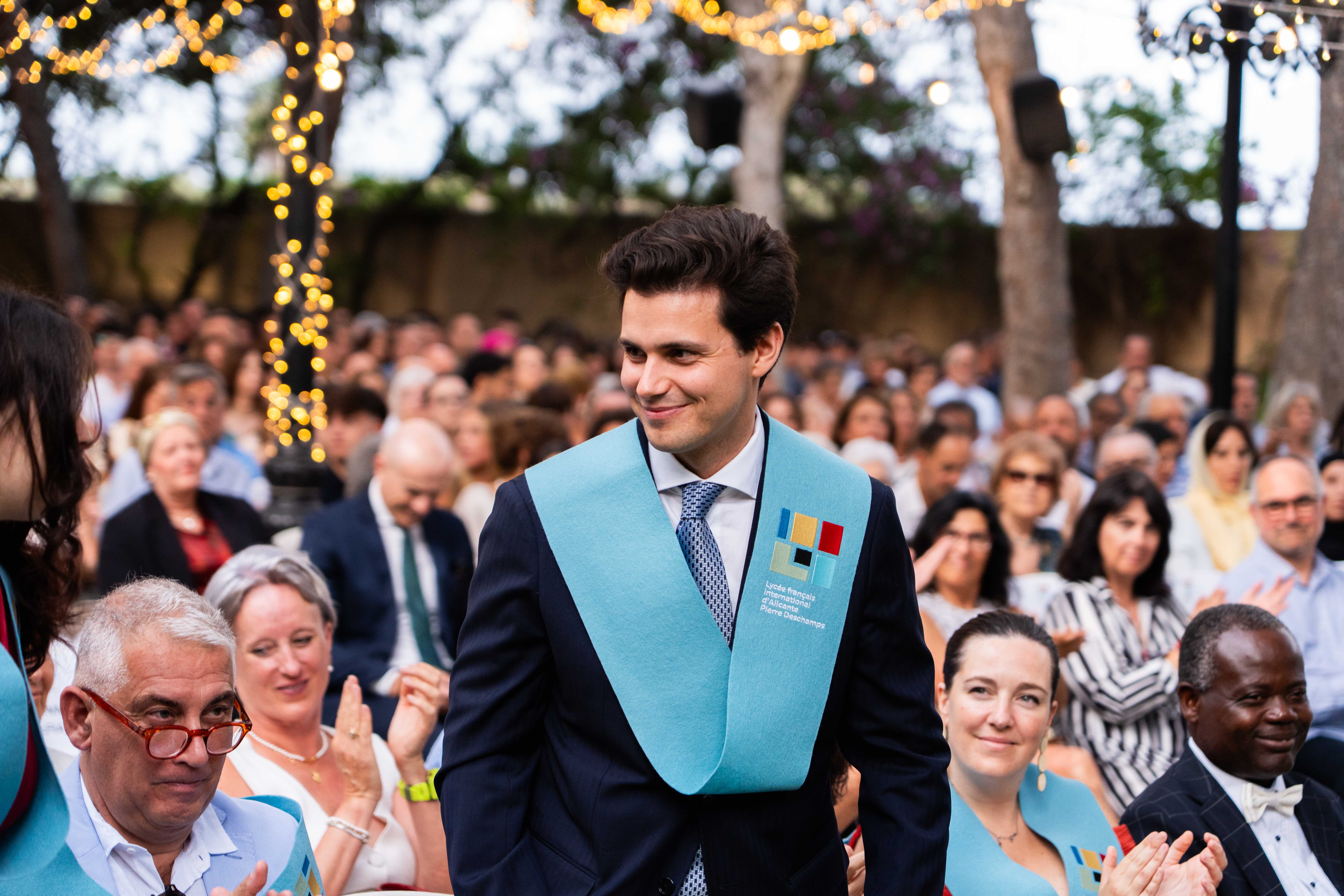  A woman with her eyes closed, wearing a helmet, appears to be in a moment of concentration or relaxation.