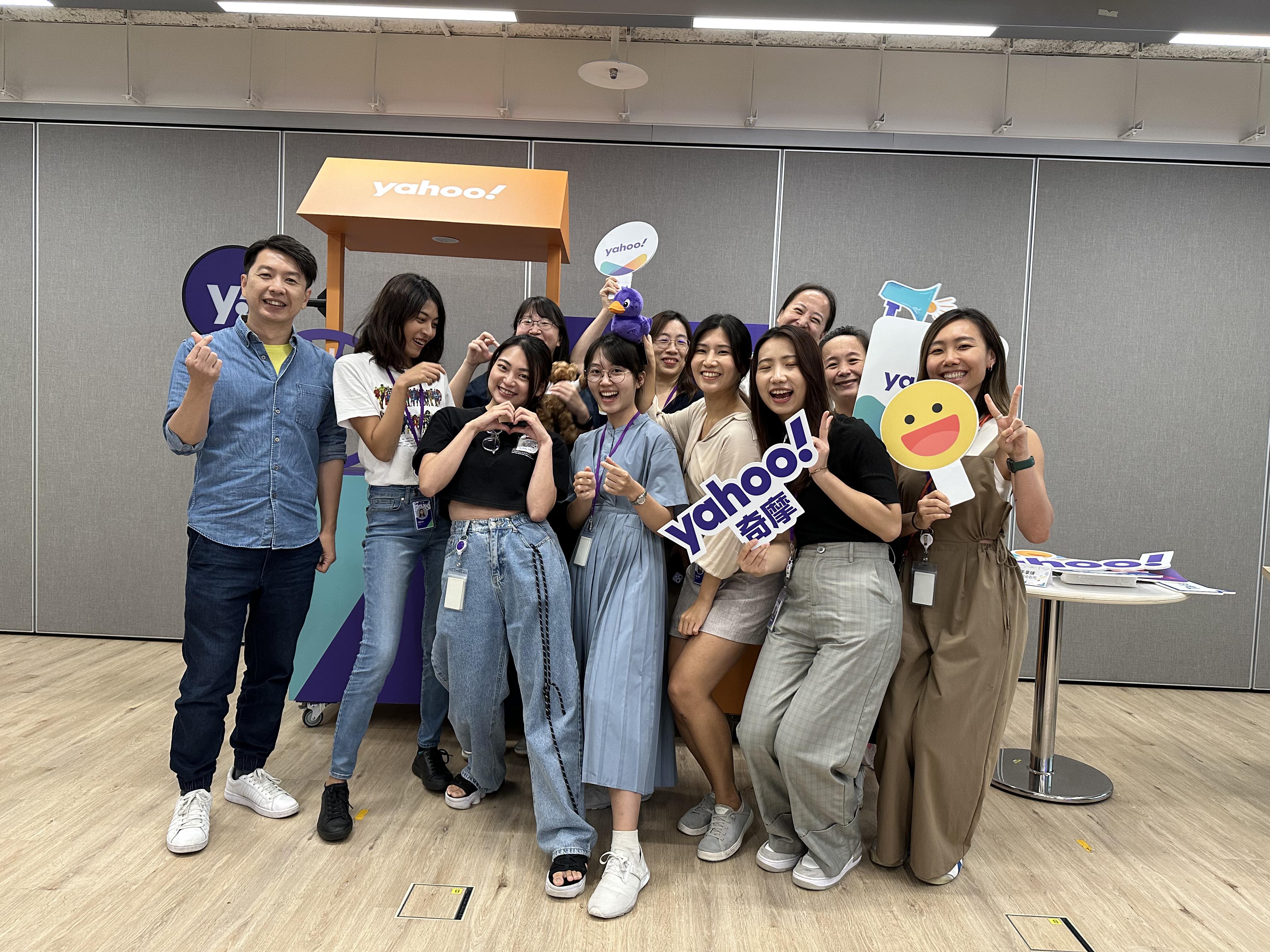 a group of people walking on a sidewalk