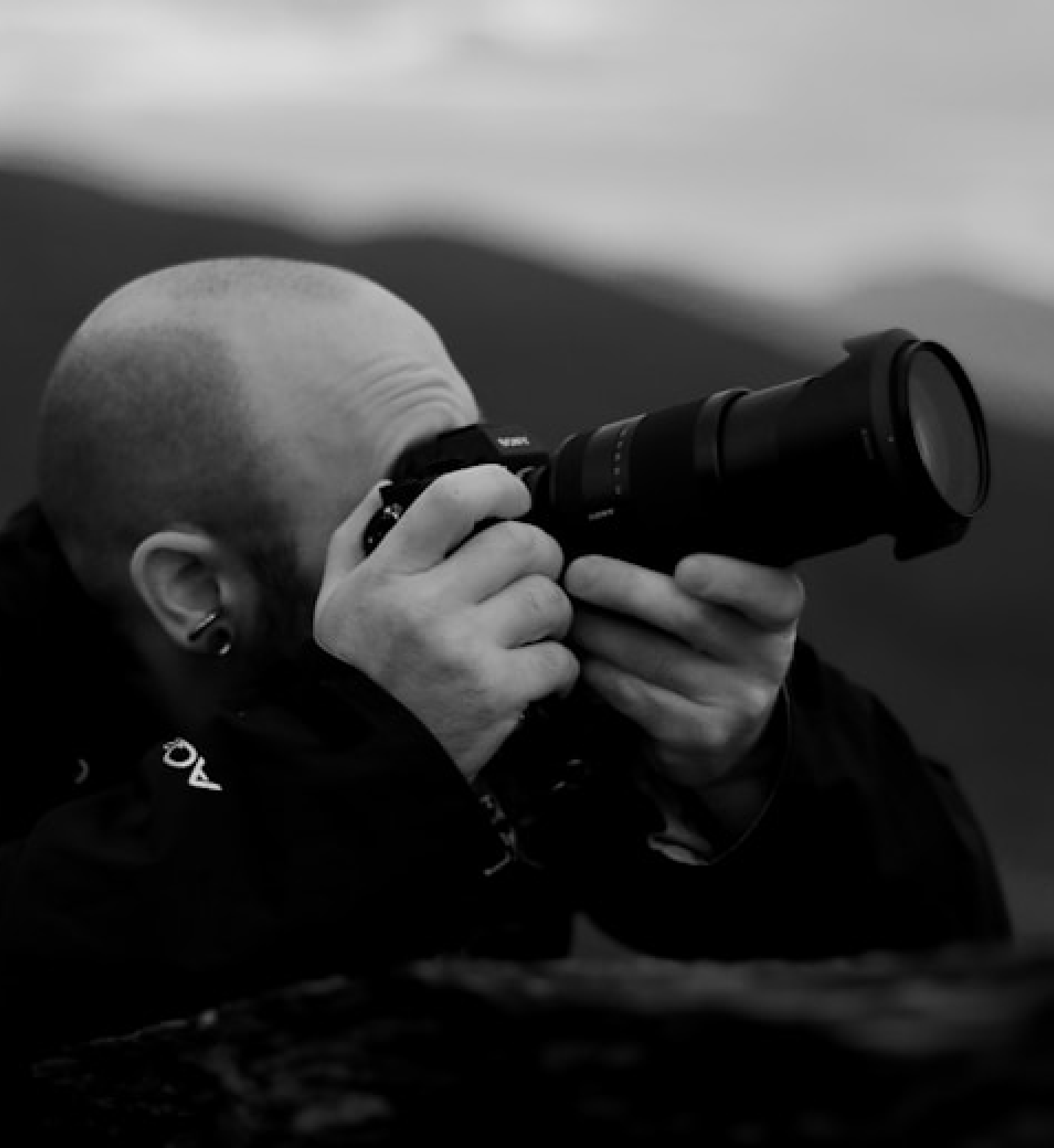 black and white photographer and his camera 2