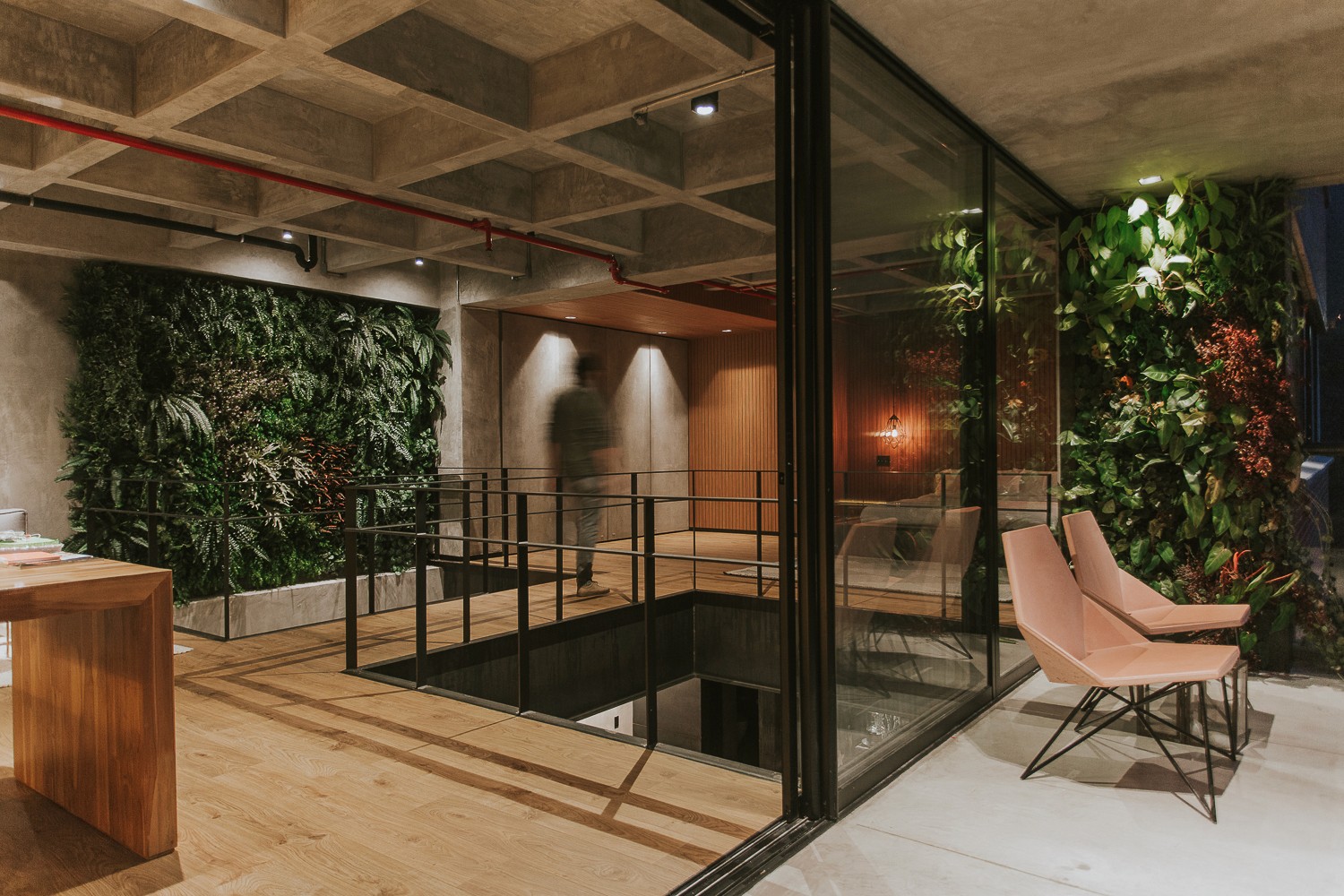 Double-height interior with flowing sculptural forms and warm raking light