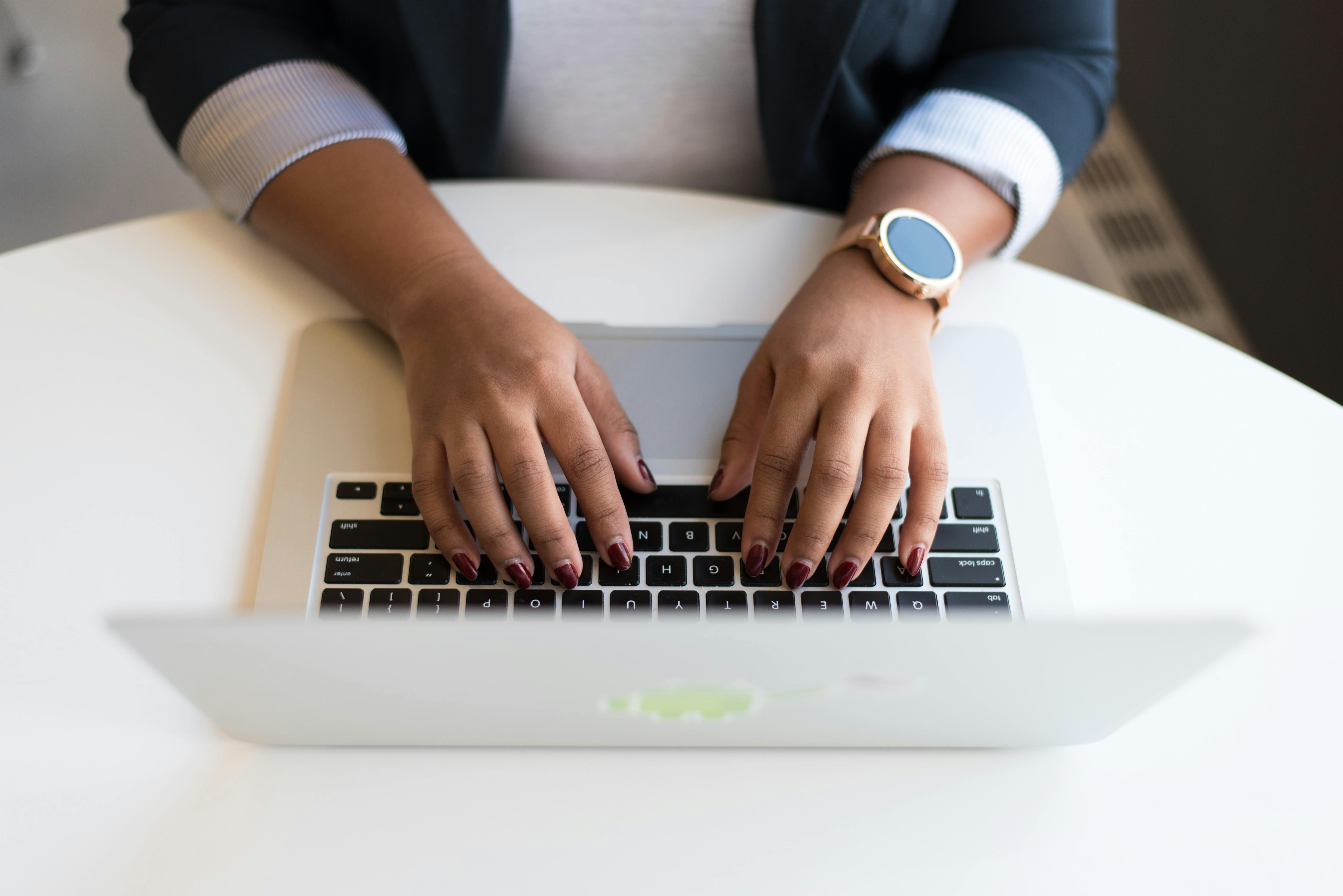 Man typing on laptop