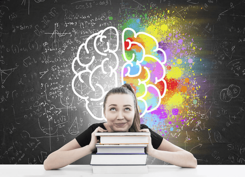High school student working on psychology research with a mentor at a university library in 2026