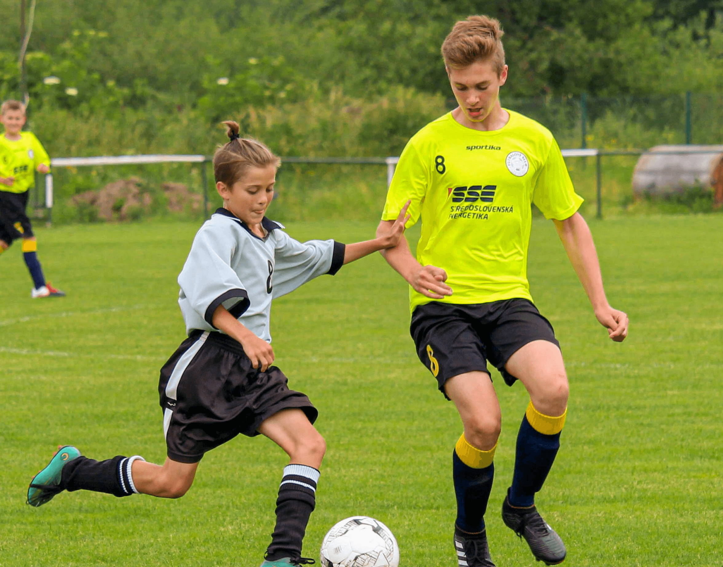 Two boys playing soccer