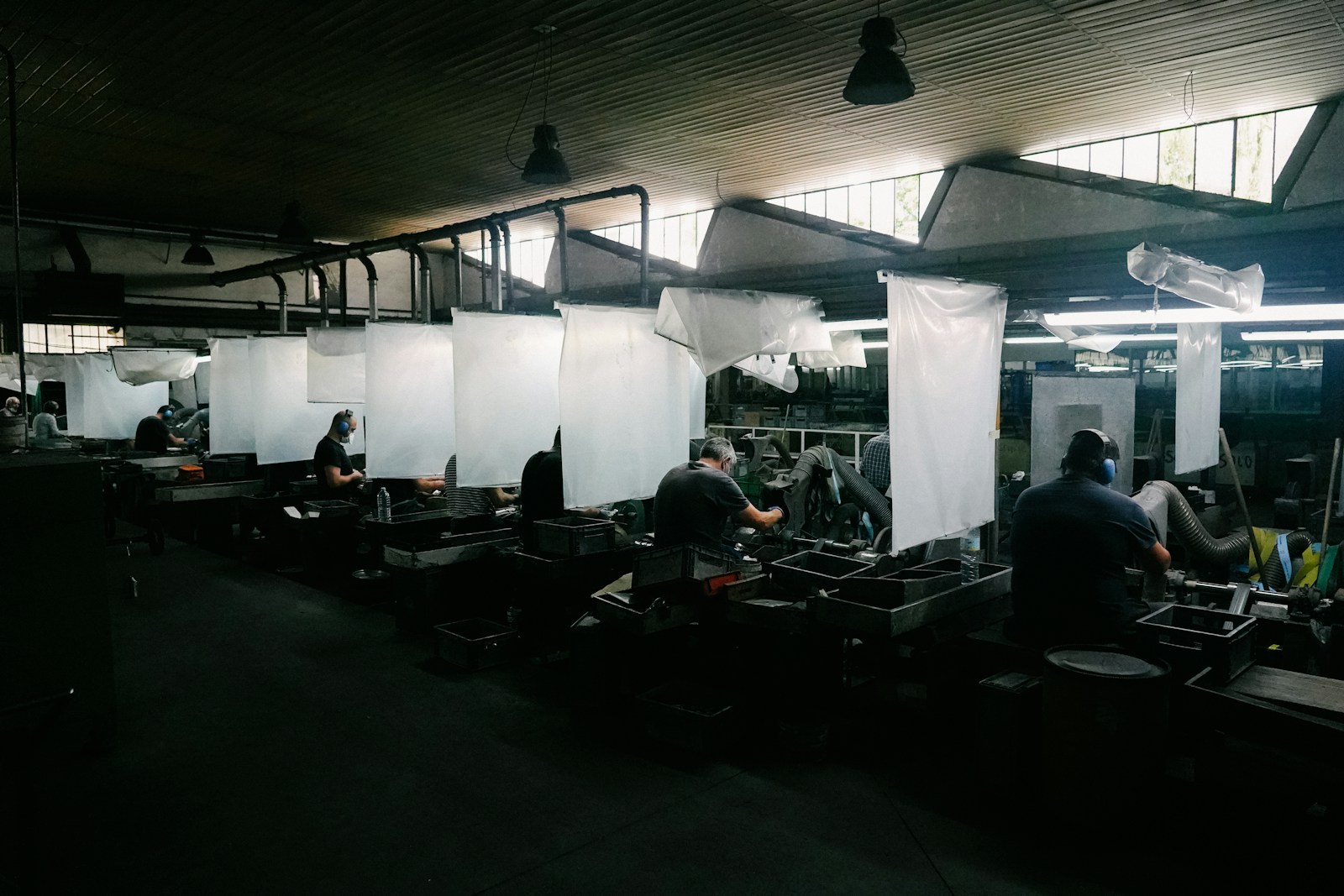 Workers on an active factory floor