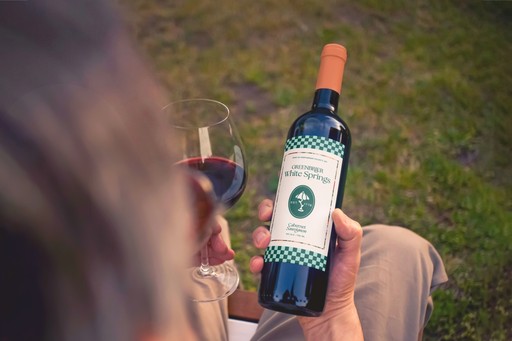 Bottle of wine, with a customized Greenbrier label.