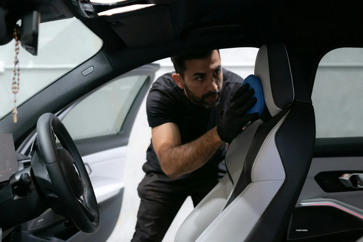 HyperAuto Care Interior Detailing service process in a professional auto care workshop