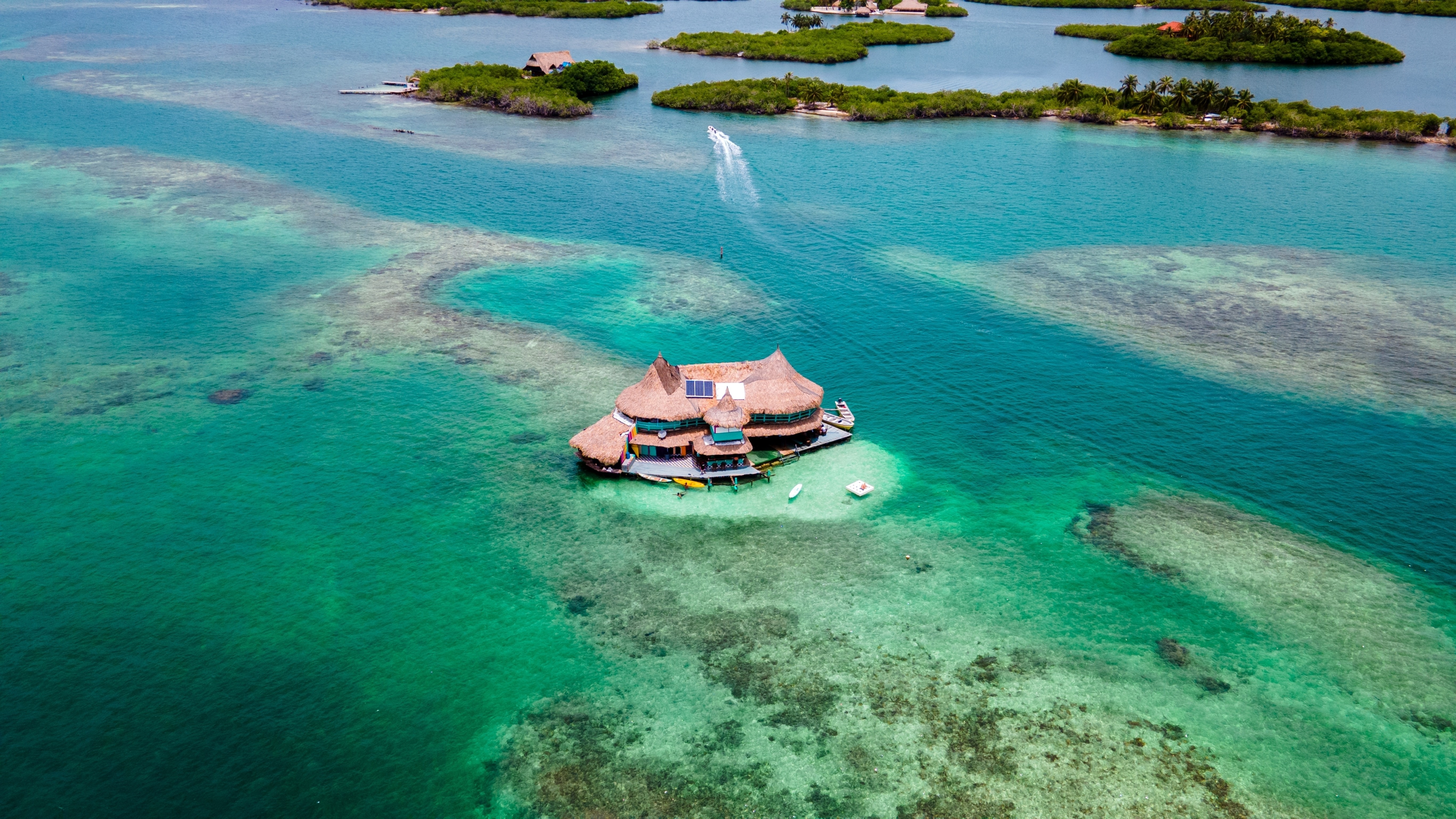 A house that is also an island surrounded by tropical waters