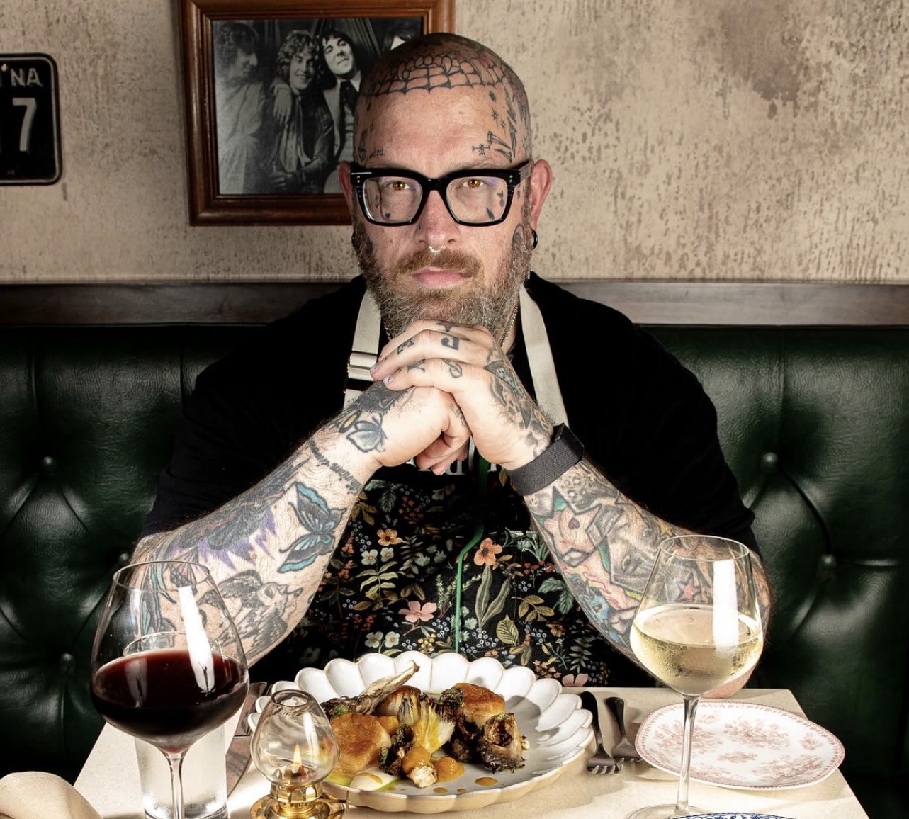 Portrait of Chef Ron Anderson standing in an apron inside Palace Kitchen.