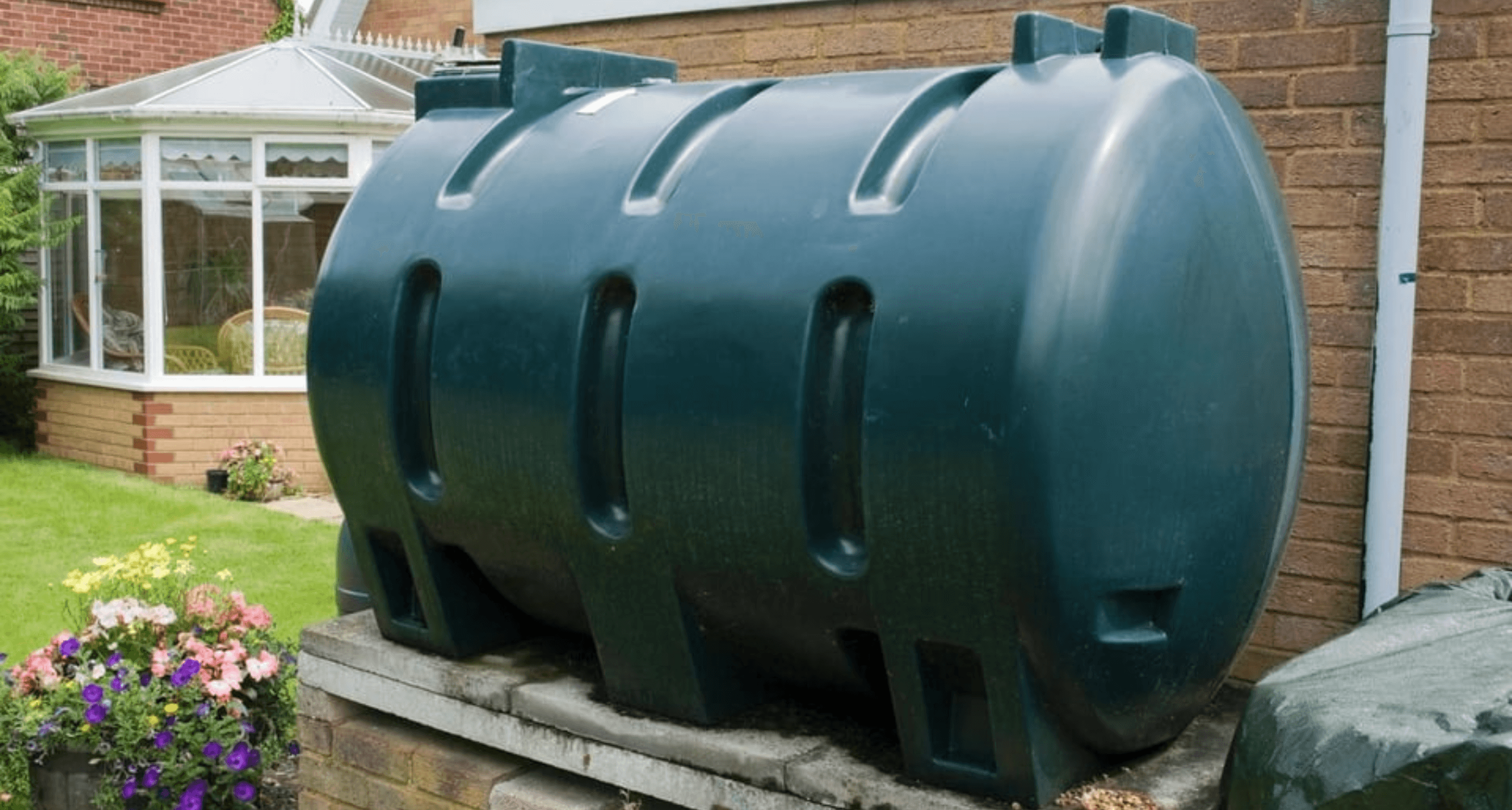 A photo of a domestic oil taking in the back garden of a UK property.