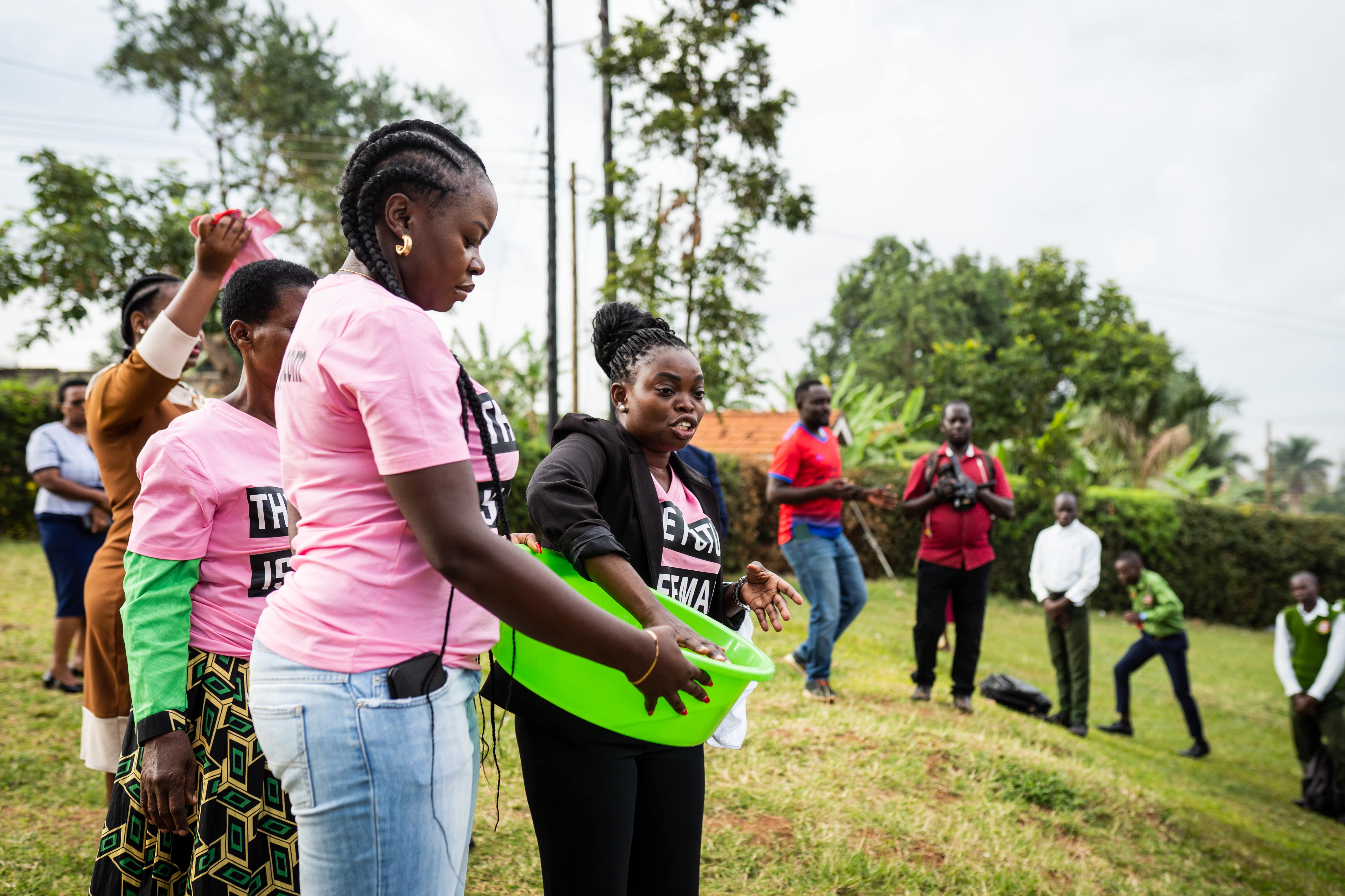 “The SHE FOR SHE founder and a volunteer distributing products.