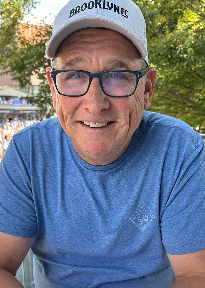 Headshot of Tom Lyons