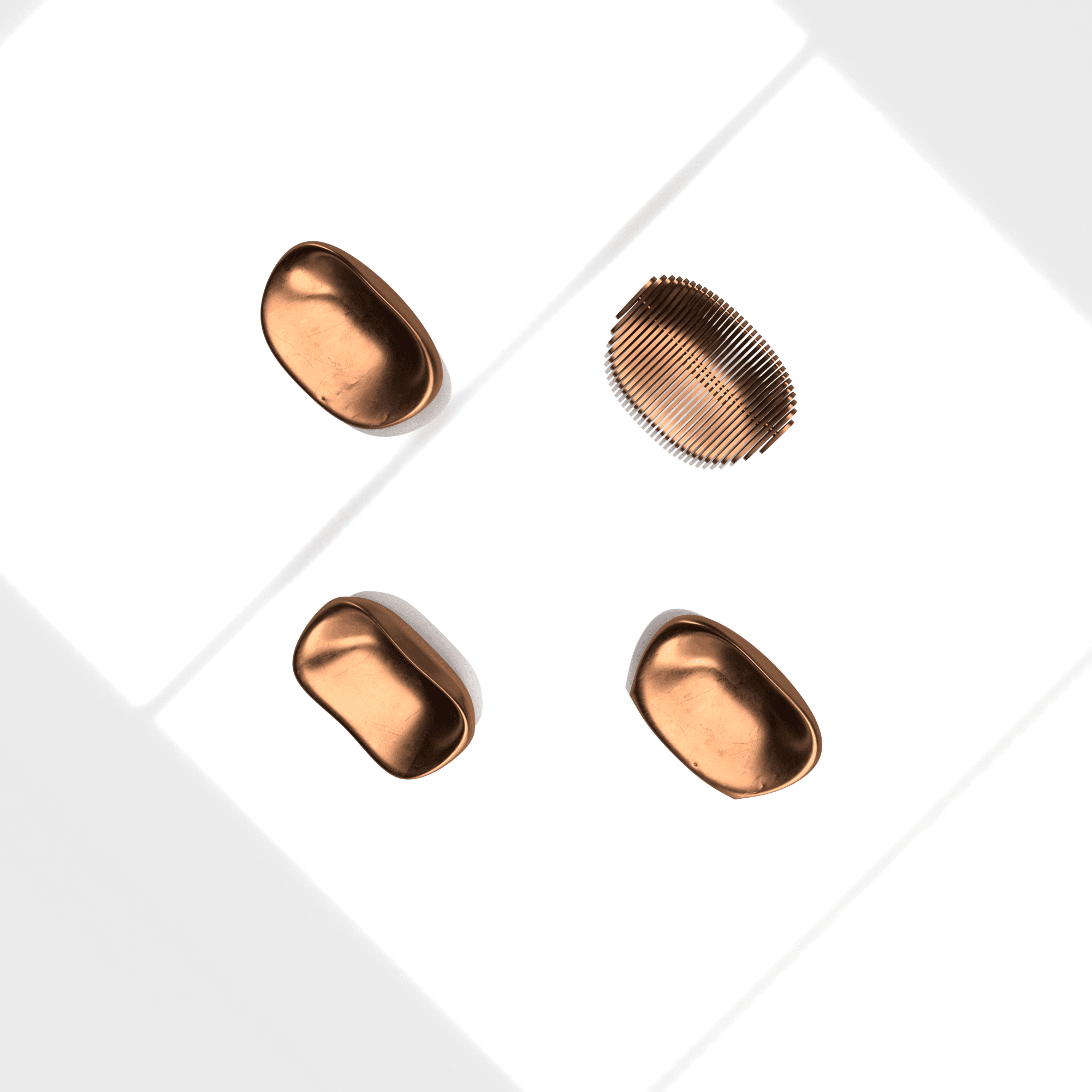 Top view of copper furniture-form studies on a white surface