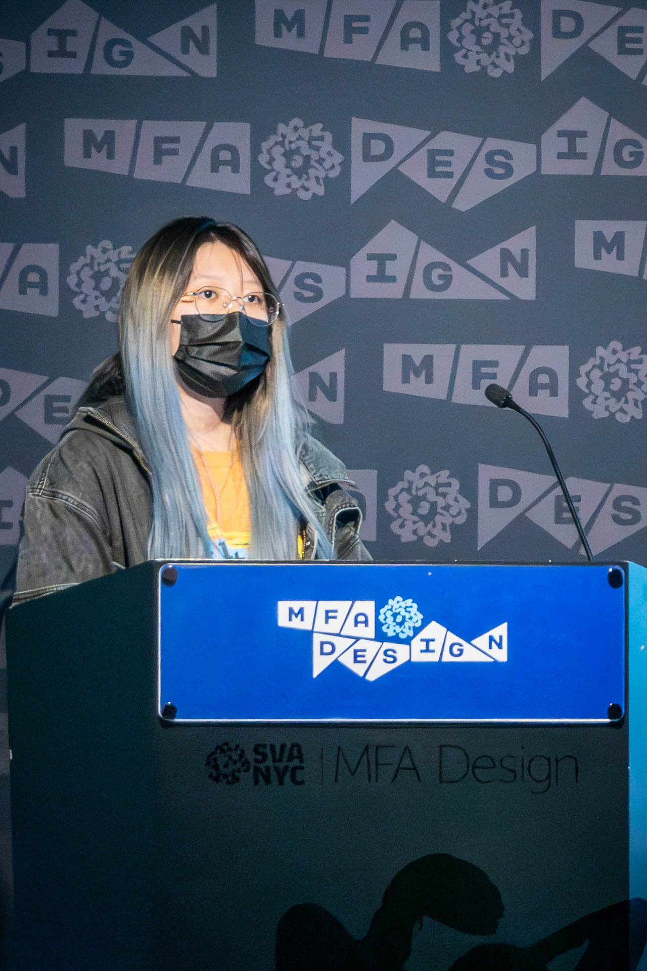 student at a podium giving a presentation