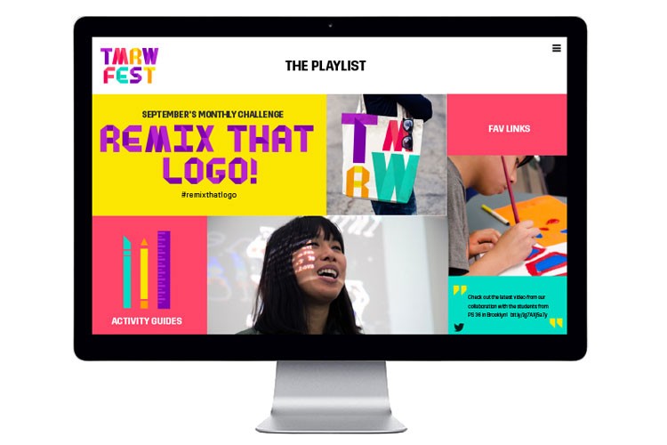 A computer monitor displays the TARW Fest website. The screen shows colorful text and images, including “September’s Monthly Challenge,” “Remix That Logo!”, “Activity Guides”, and “Fav Links”. A person with dark hair is smiling at the screen. The website includes social media links at the bottom.