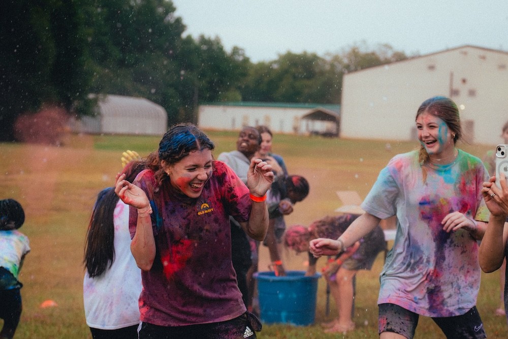 Girls having a blast, covered in color bombs at our Back-to-School Blast