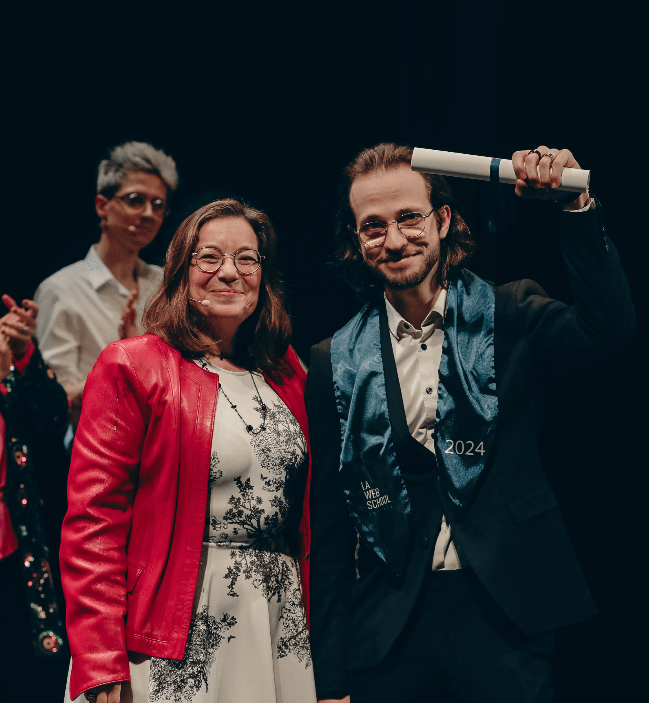 A picture of me (Axel Dufour) brandishing my diploma up high (the Web School Factory's diploma) at the handover ceremony.