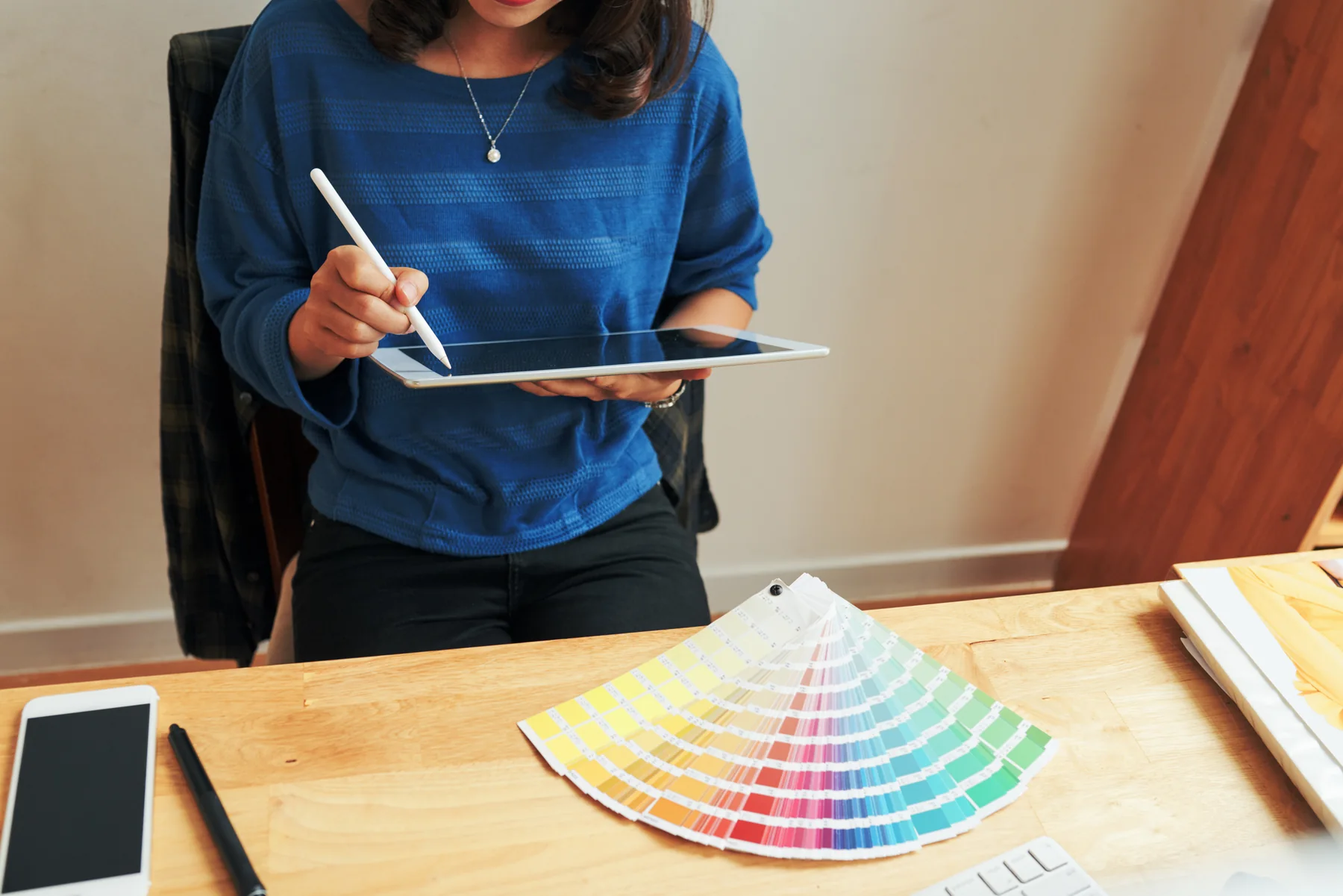 Digital Artist Using Tablet at Wood Desk