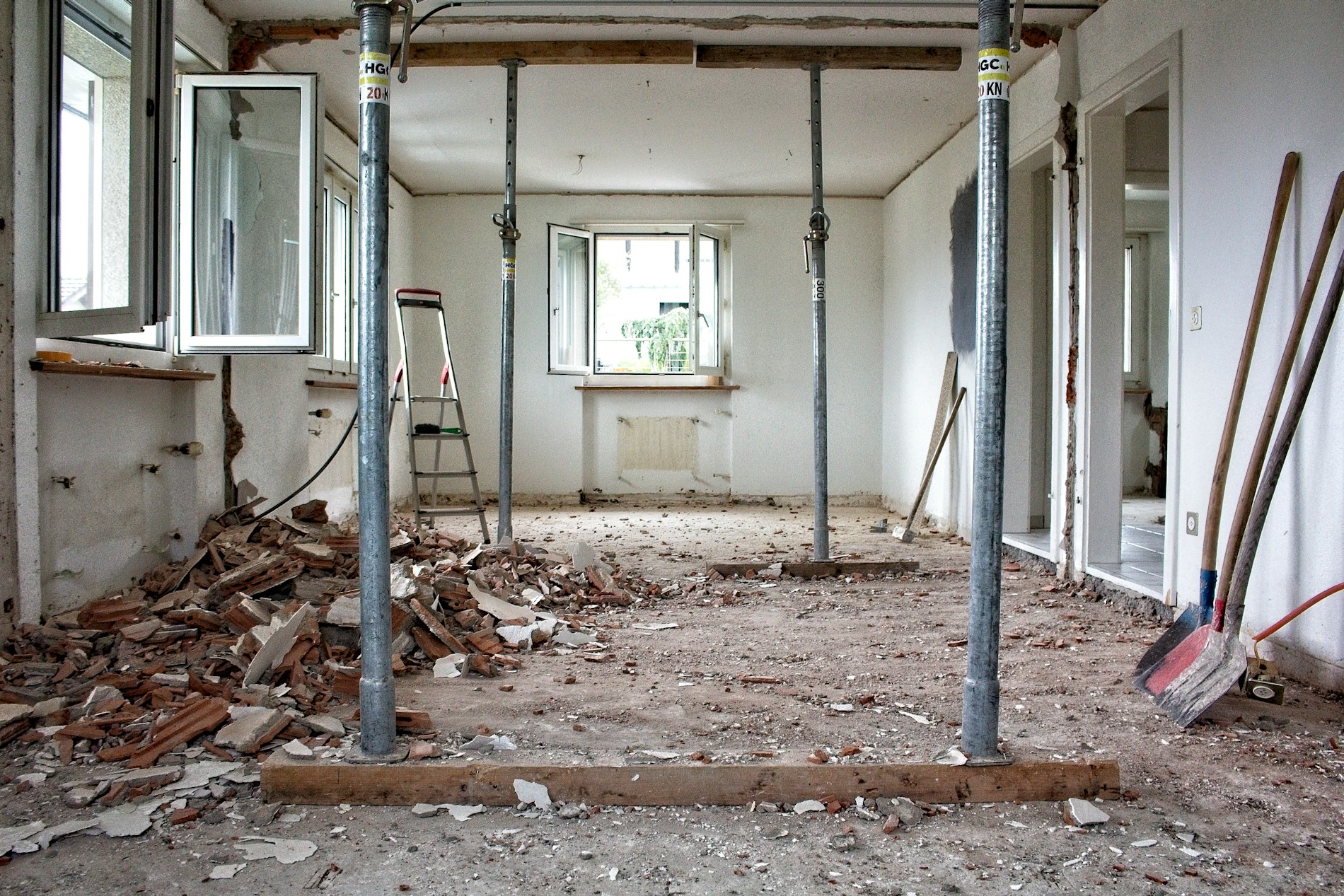 Renovation in progress with structural supports and exposed walls