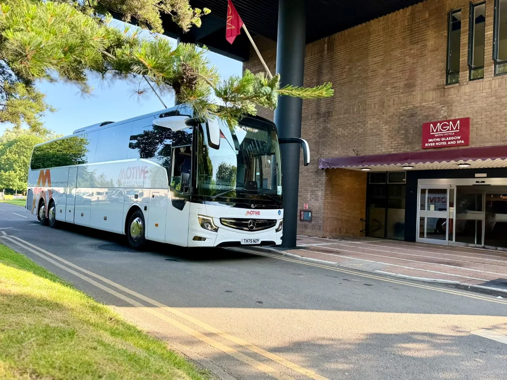 Luxury coach and minibus fleet used for city tours and private transfers, showcasing premium travel services and modern design in urban and scenic environments