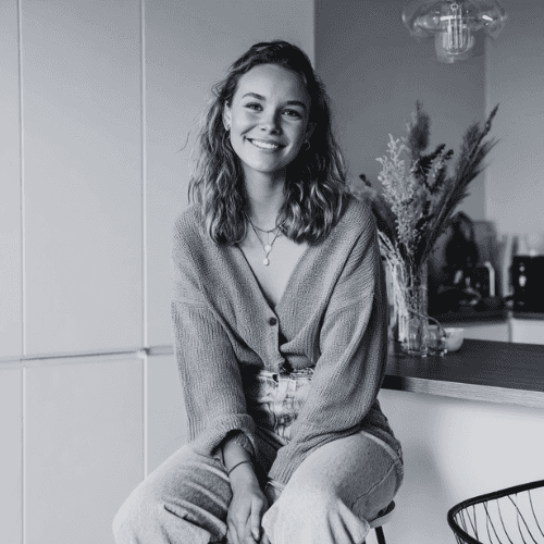 Sara is a client smiling to the camera happily