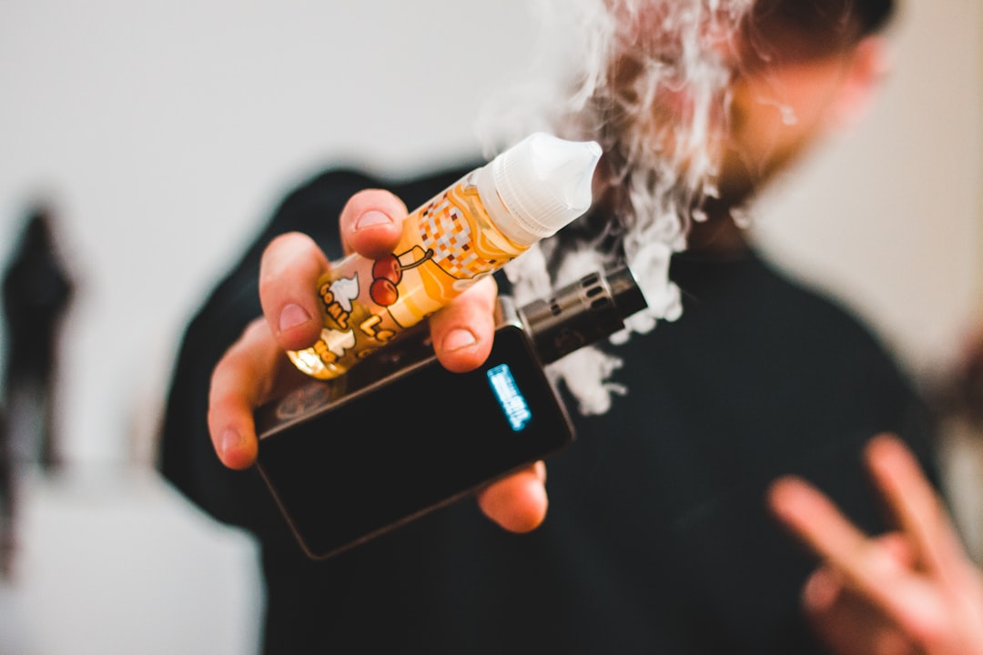 man holding box mod