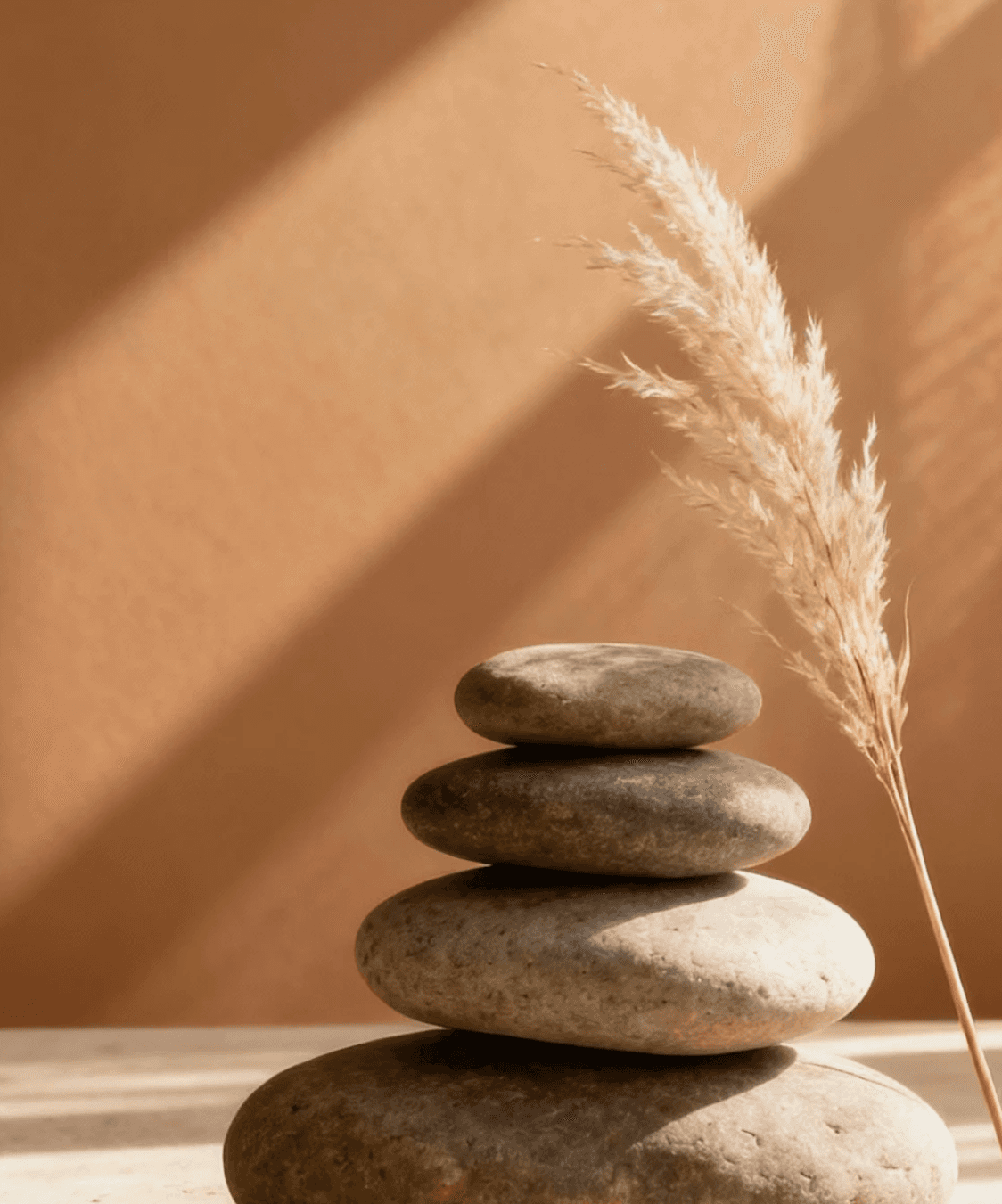 Stacked spa stones and dried grass