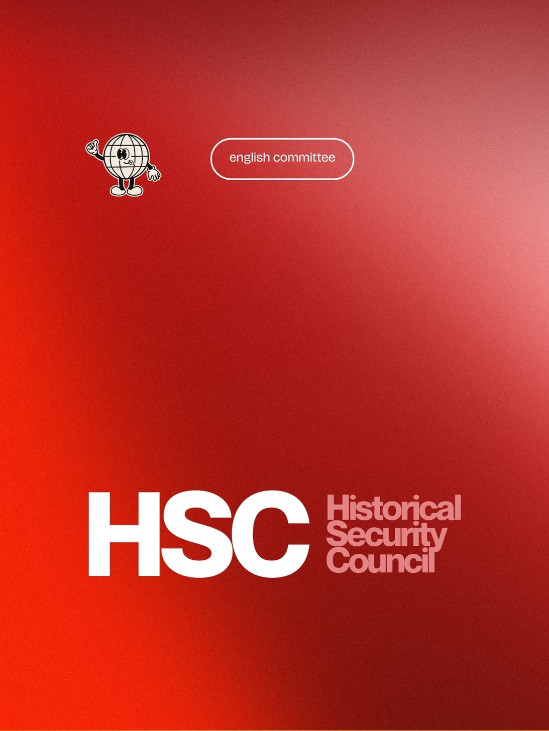 Smiling young man with curly hair, wearing a dark hoodie, against a softly lit background.