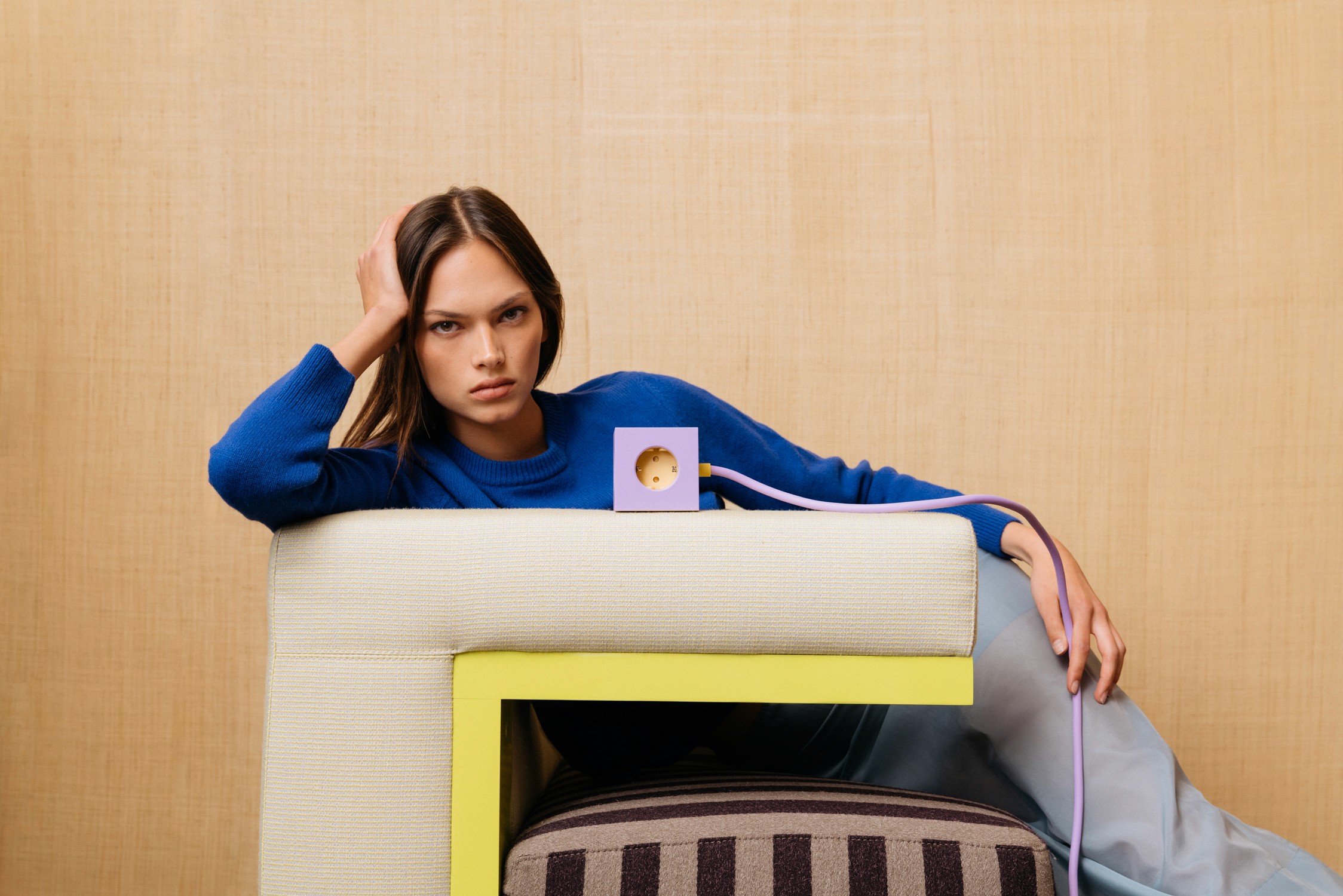 Streetside billboard with flyposters of the Batch.Works brand and illustrations