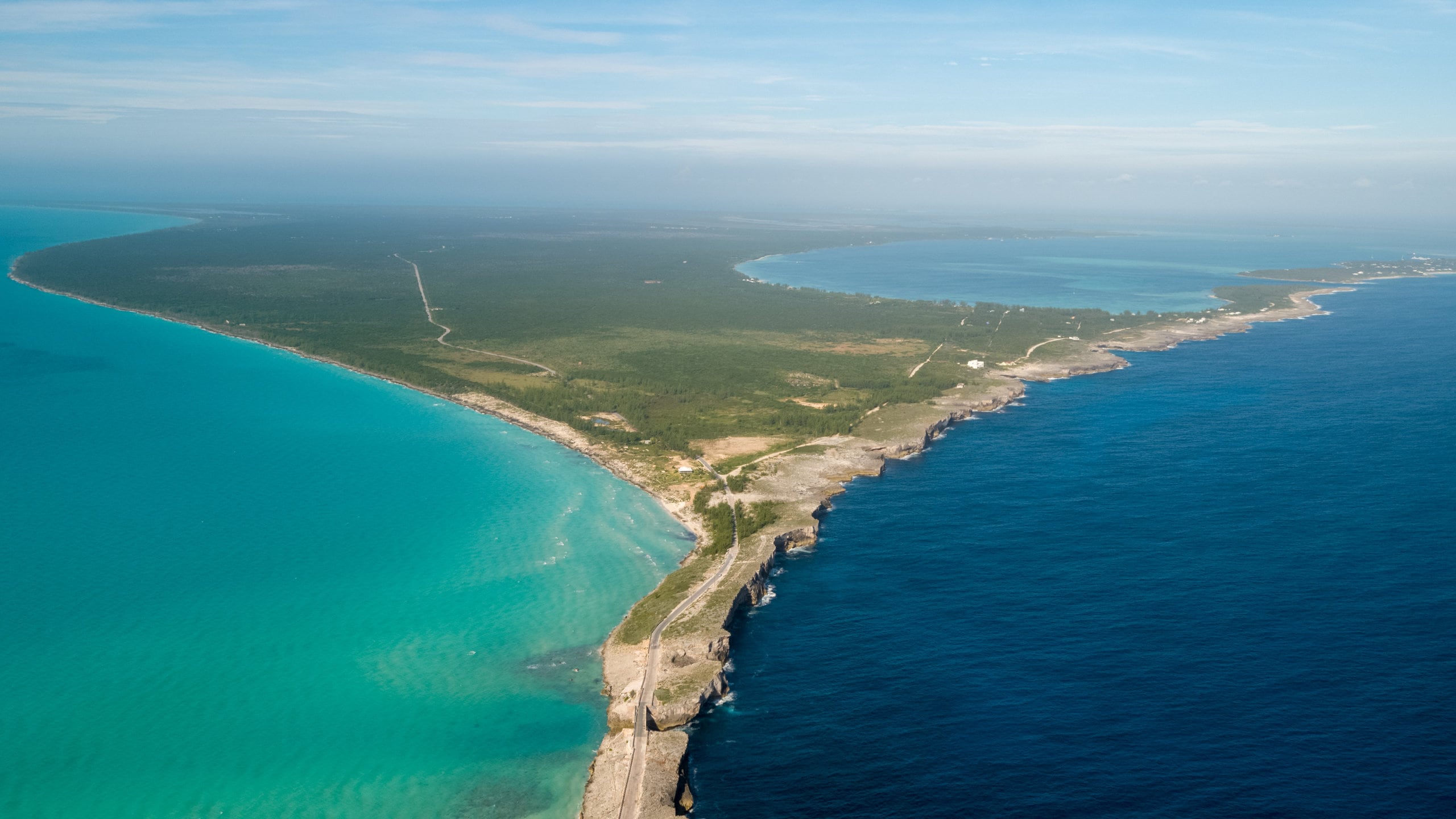 An aerial view of a highway near the ocean
