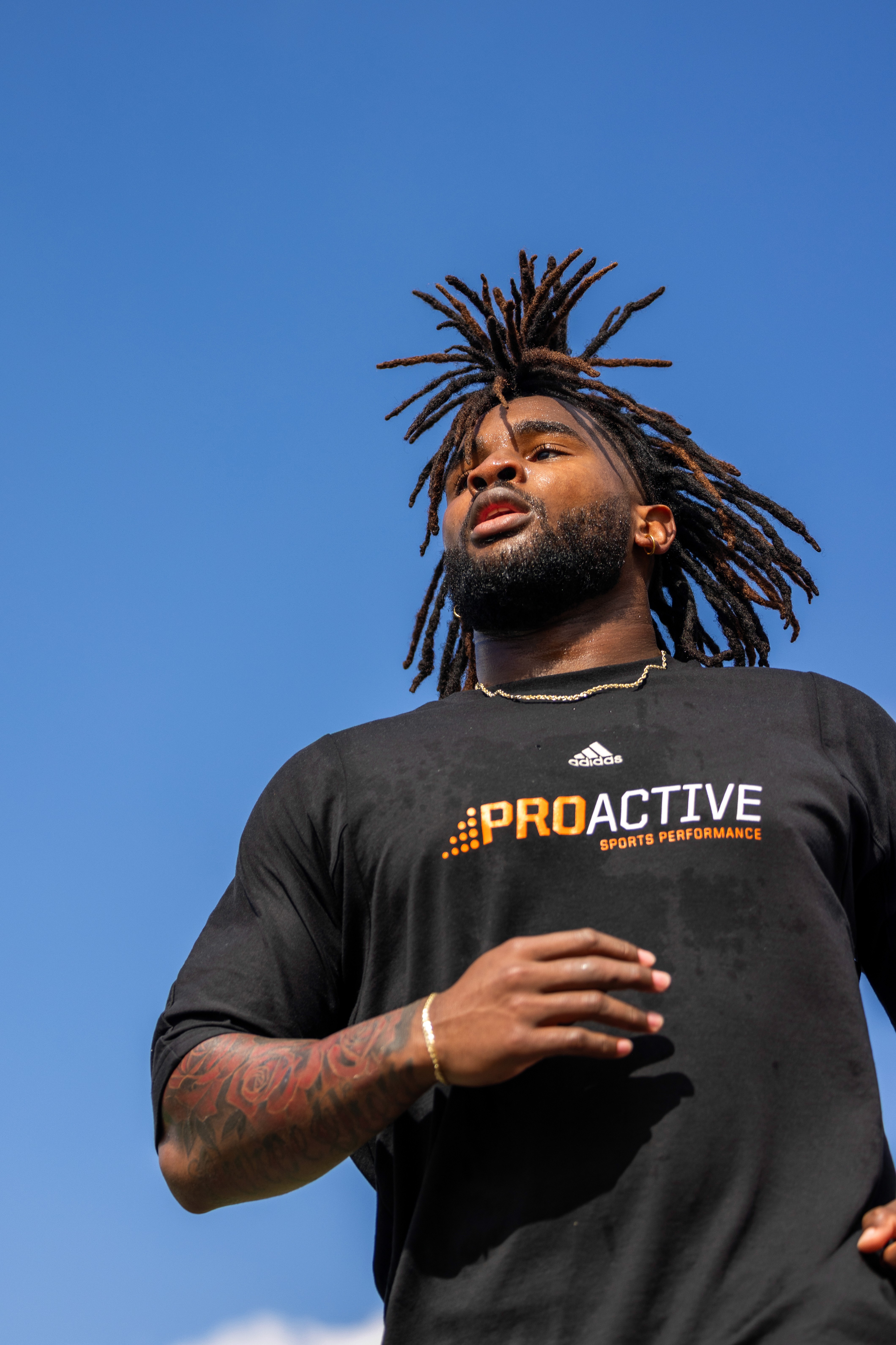 a woman holding a red flower
