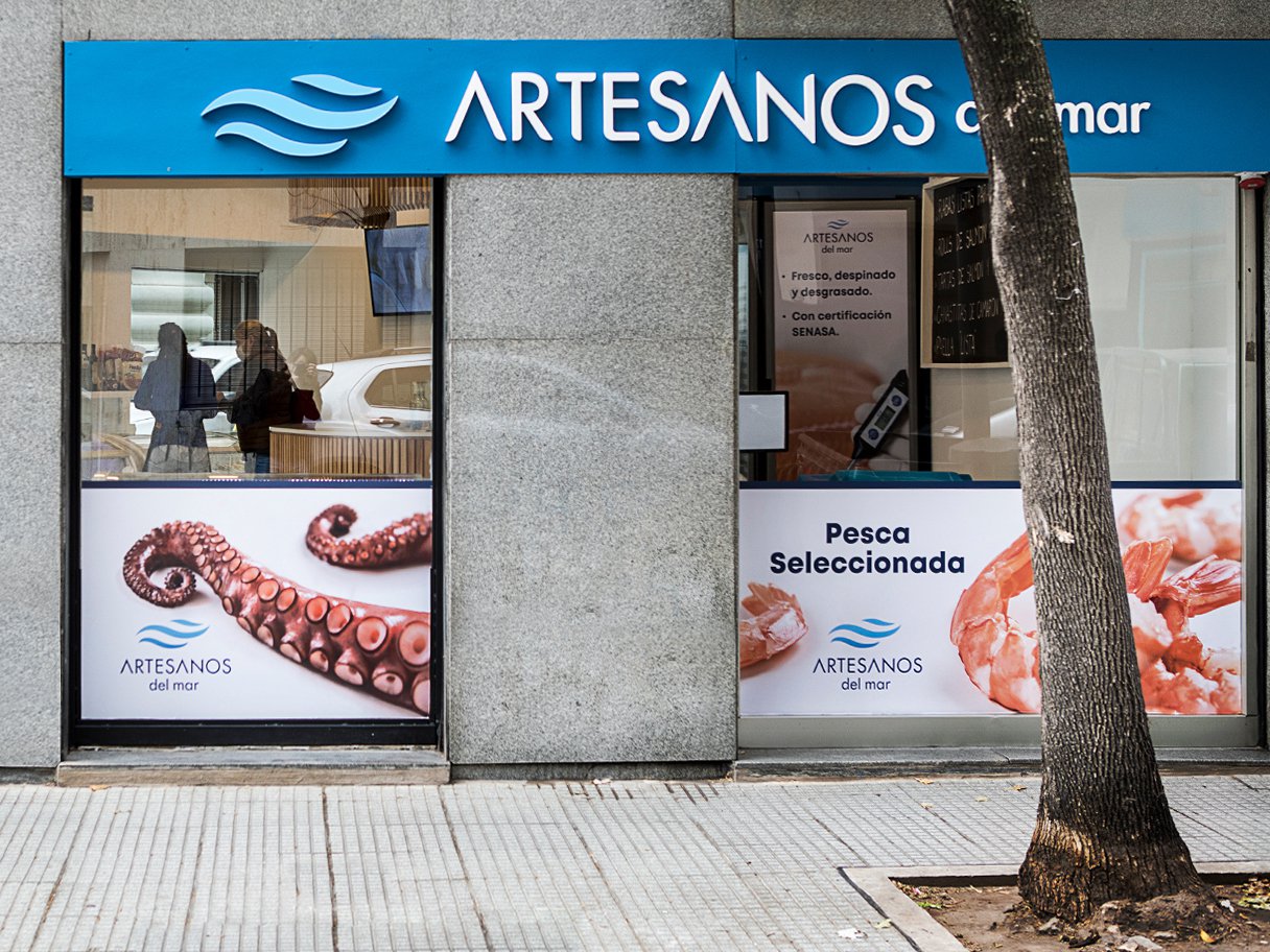 Rooftops of a coastal town with the sea in background