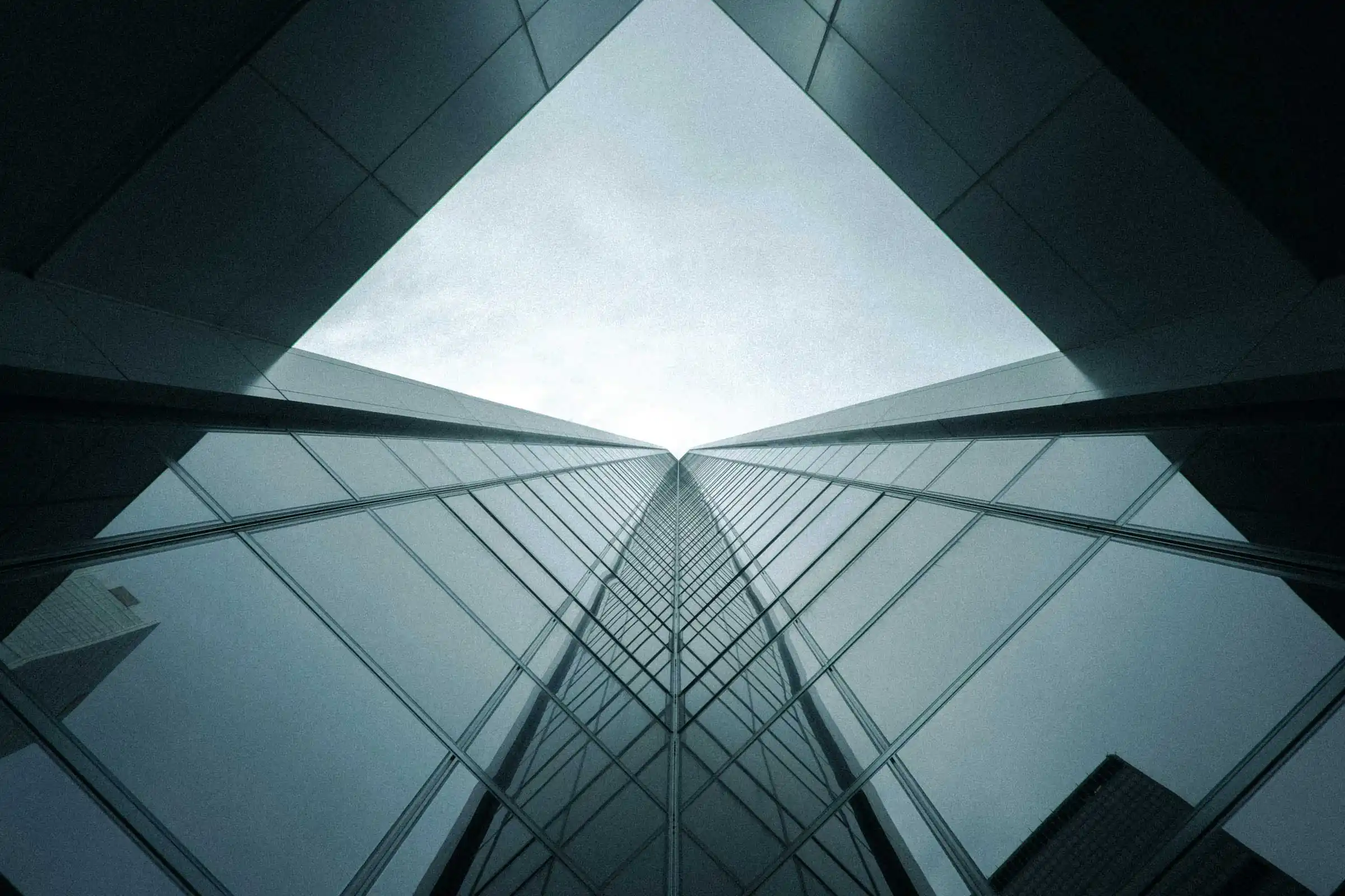 Low angle view of a modern glass skyscraper.